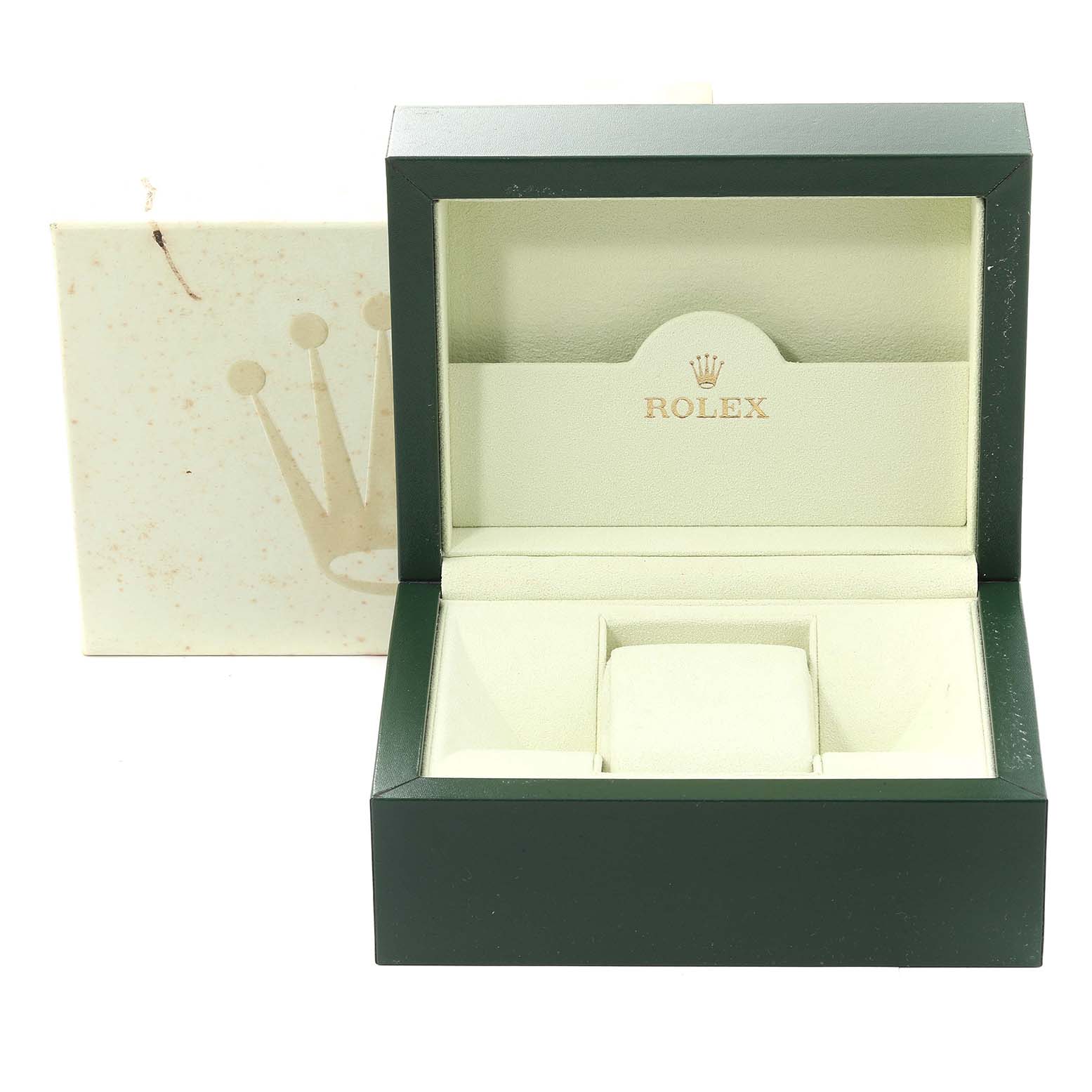 The image shows an empty green and cream Rolex watch box for the Explorer model.