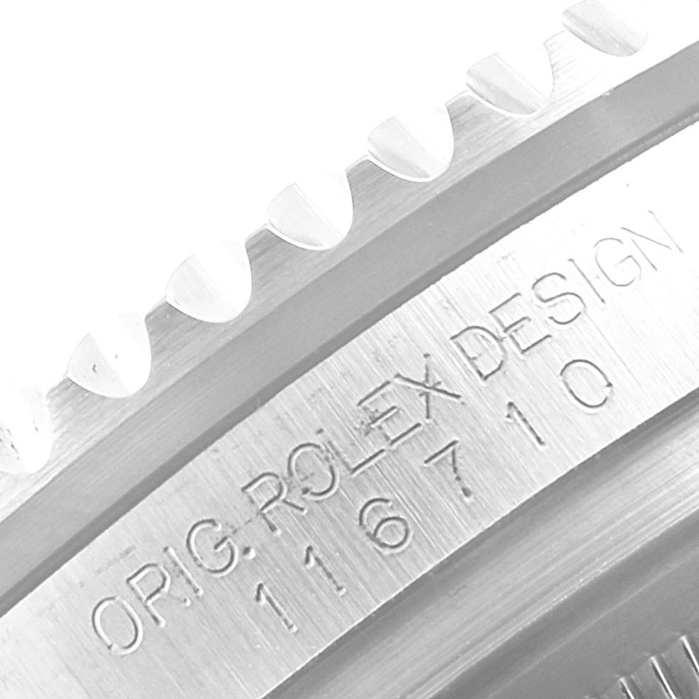 Close-up of the bezel and case side of a Rolex GMT-Master 116710 Men
s Stainless Steel Black Dial 116710 Men
s Stainless Steel Black Dial, showing engraved text and model number.