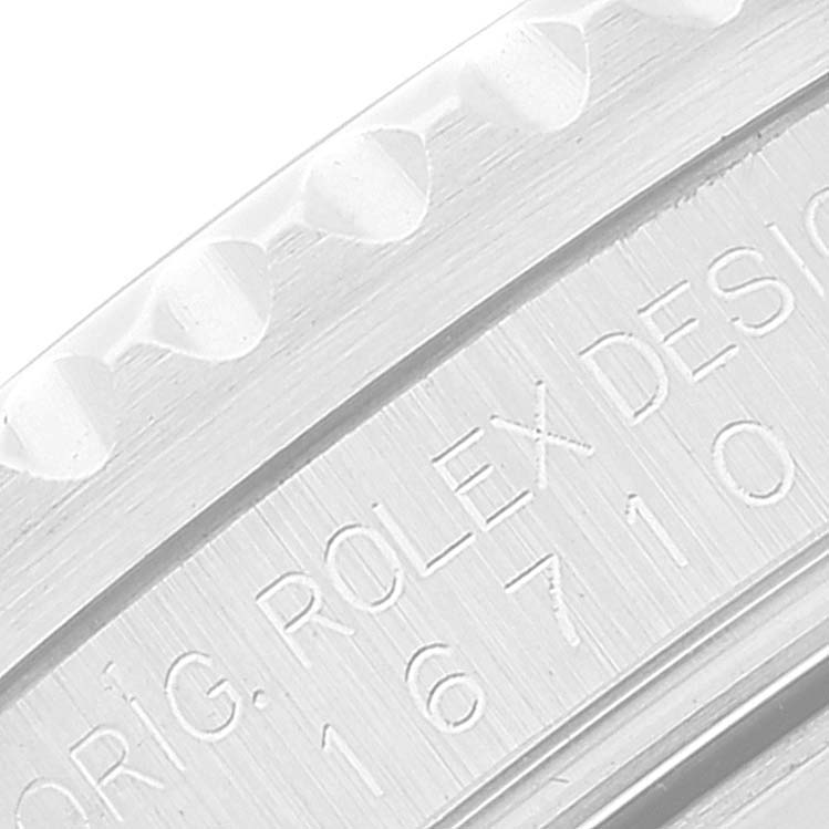 The image shows a close-up of the engraved case side of a Rolex GMT-Master 16710 Men's Stainless Steel Black Dial 16710 Men's Stainless Steel Black Dial, highlighting its serial number.