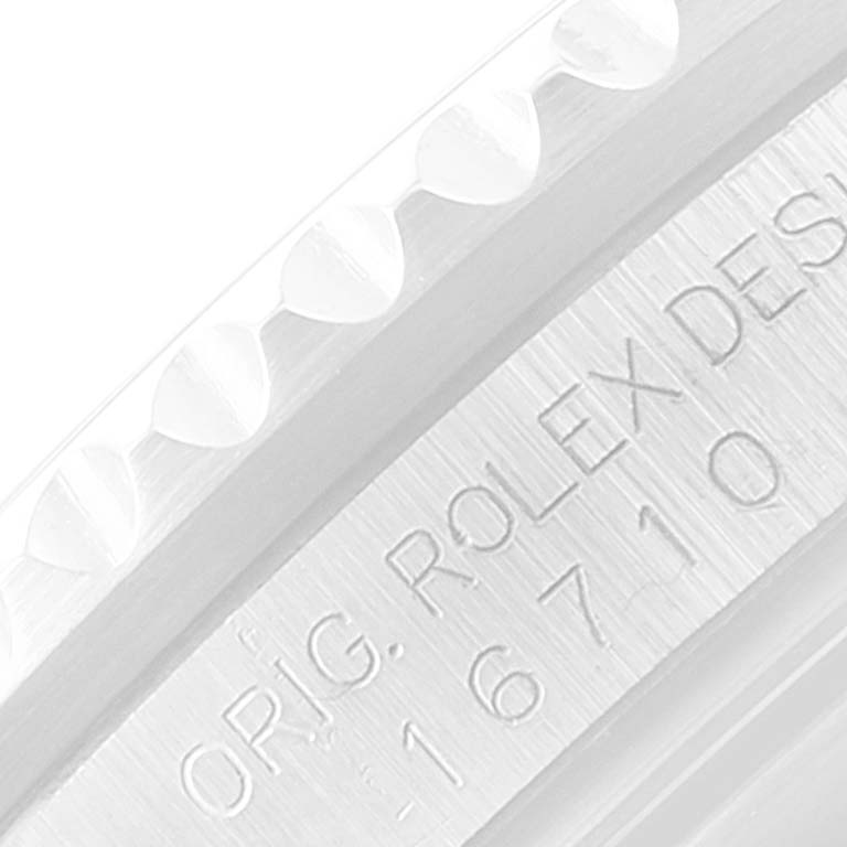 This is a close-up of the case side of a Rolex GMT-Master 16710 Men's Stainless Steel Black Dial 16710 Men's Stainless Steel Black Dial showing part of the model number engraved on it.