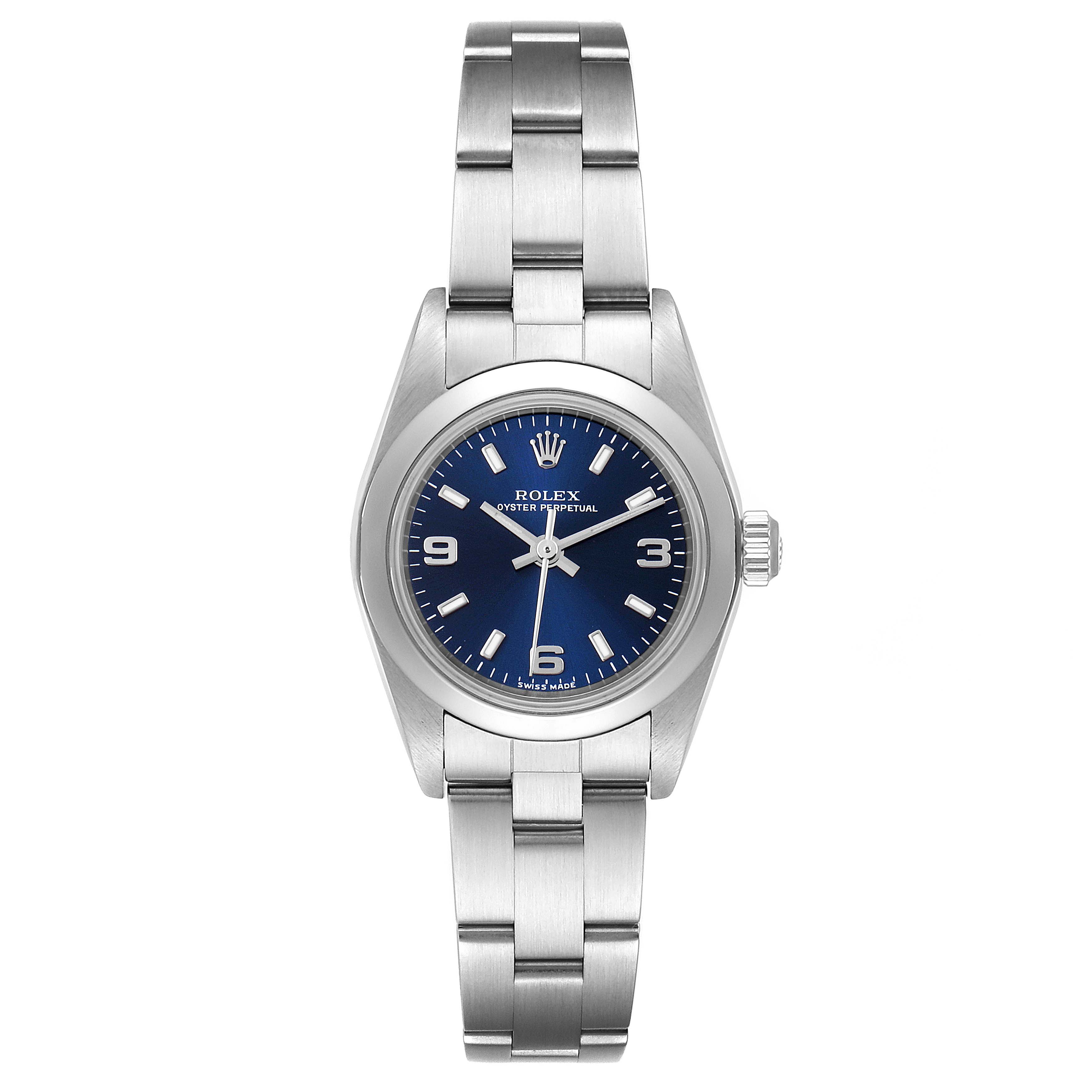 This Rolex Oyster Perpetual 76080 Women
s Stainless Steel Blue Dial 76080 Women
s Stainless Steel Blue Dial watch is shown from a front angle, featuring its blue dial, hour markers, and stainless steel bracelet.
