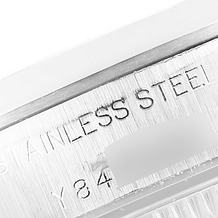 The image shows a close-up angle of the engraved text on the stainless steel case of a Rolex Oyster Perpetual 76080 Women
s Stainless Steel Blue Dial 76080 Women
s Stainless Steel Blue Dial watch.