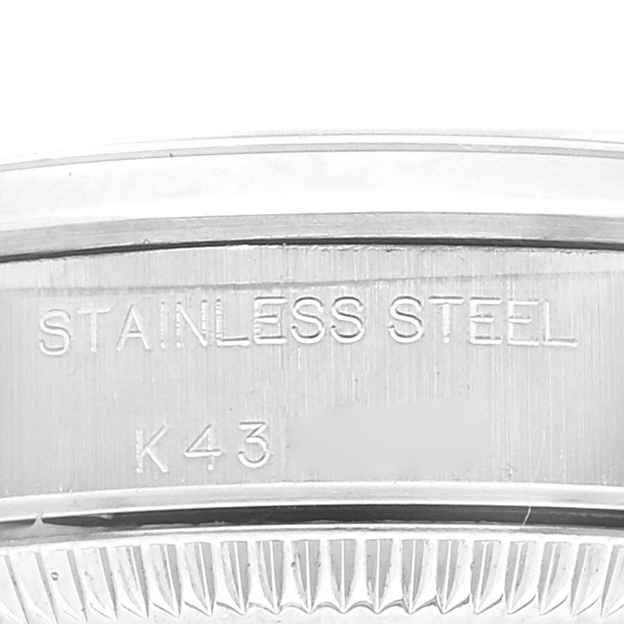 This image shows the case back of the Rolex Oyster Perpetual 76080 Women's Stainless Steel Black Dial 76080 Women's Stainless Steel Black Dial watch, specifically highlighting the "STAINLESS STEEL" engraving.