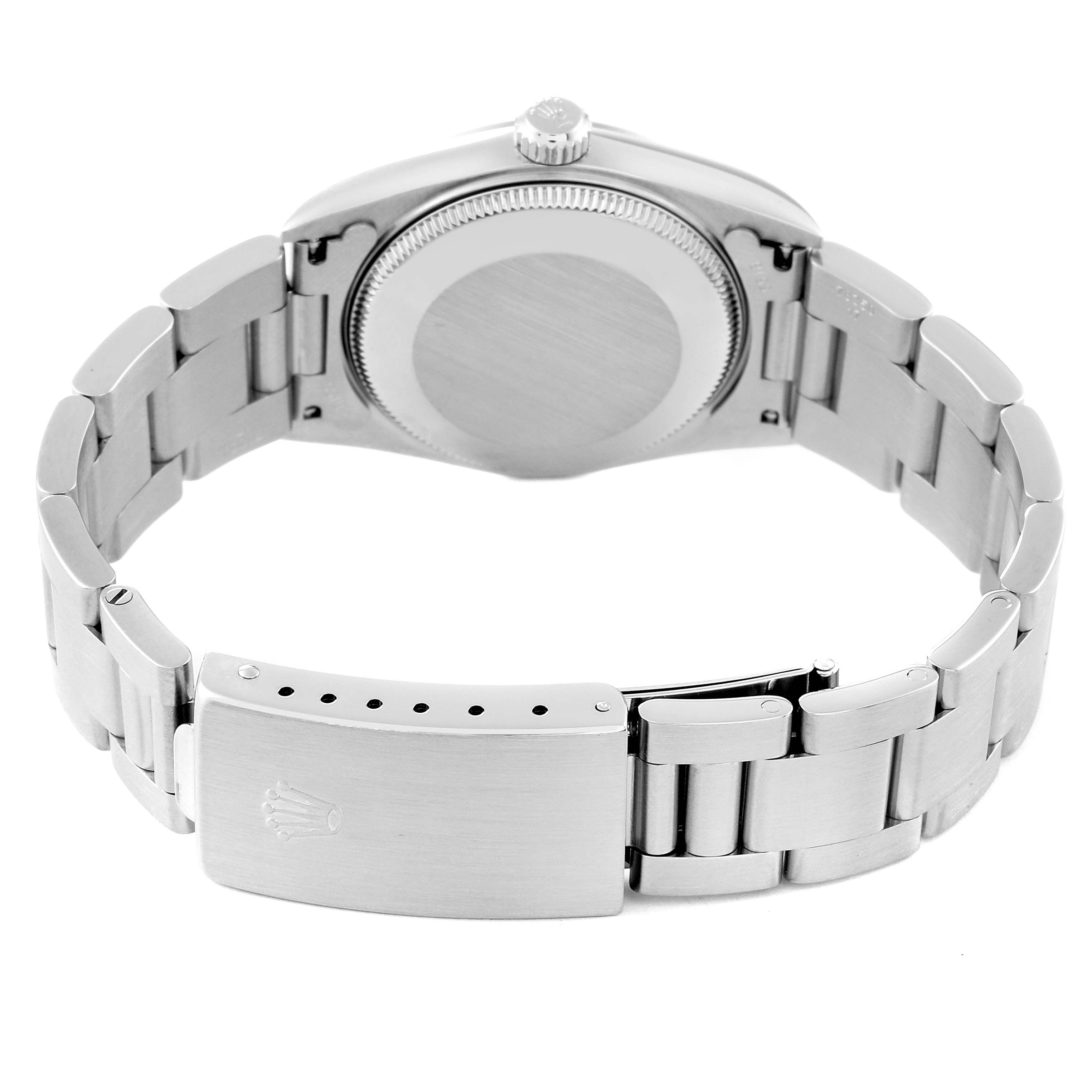 This image shows the rear view of a Rolex Mid-Size 77080 Women's Stainless Steel Black Dial 77080 Women's Stainless Steel Black Dial model watch, highlighting the case back and clasp of the metal bracelet.