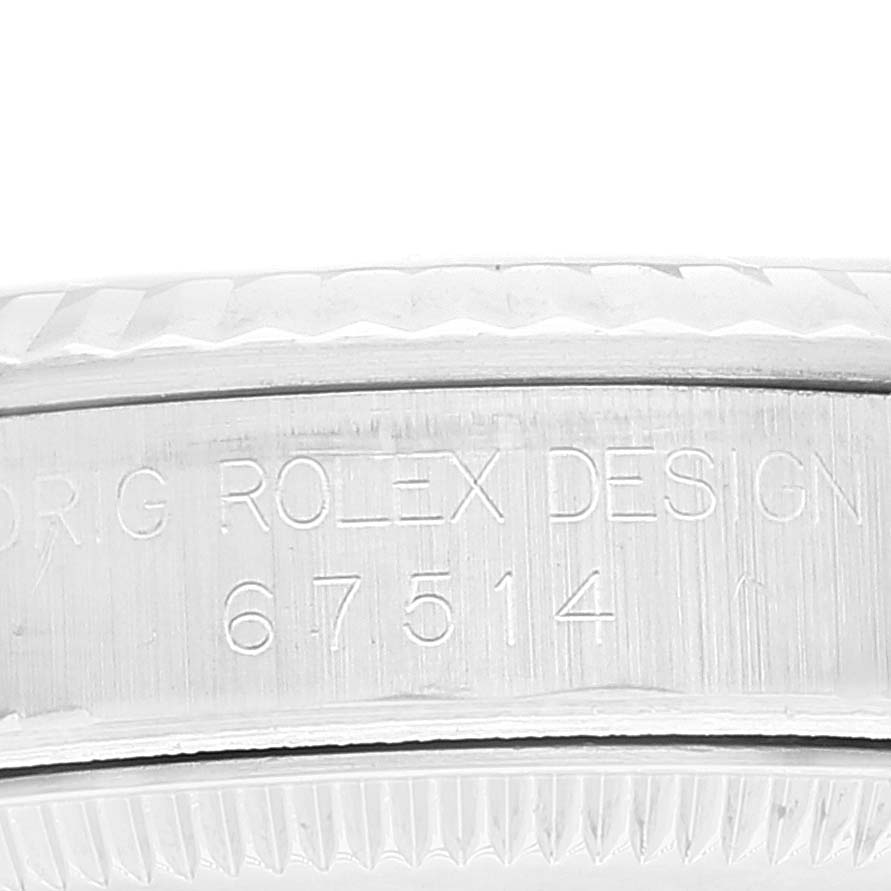 This is a close-up view of the case side and bezel engraving of a Rolex Mid-Size 67514 Women
s Stainless Steel Blue Dial 67514 Women
s Stainless Steel Blue Dial model, showing the serial number and "ORIG ROLEX DESIGN".