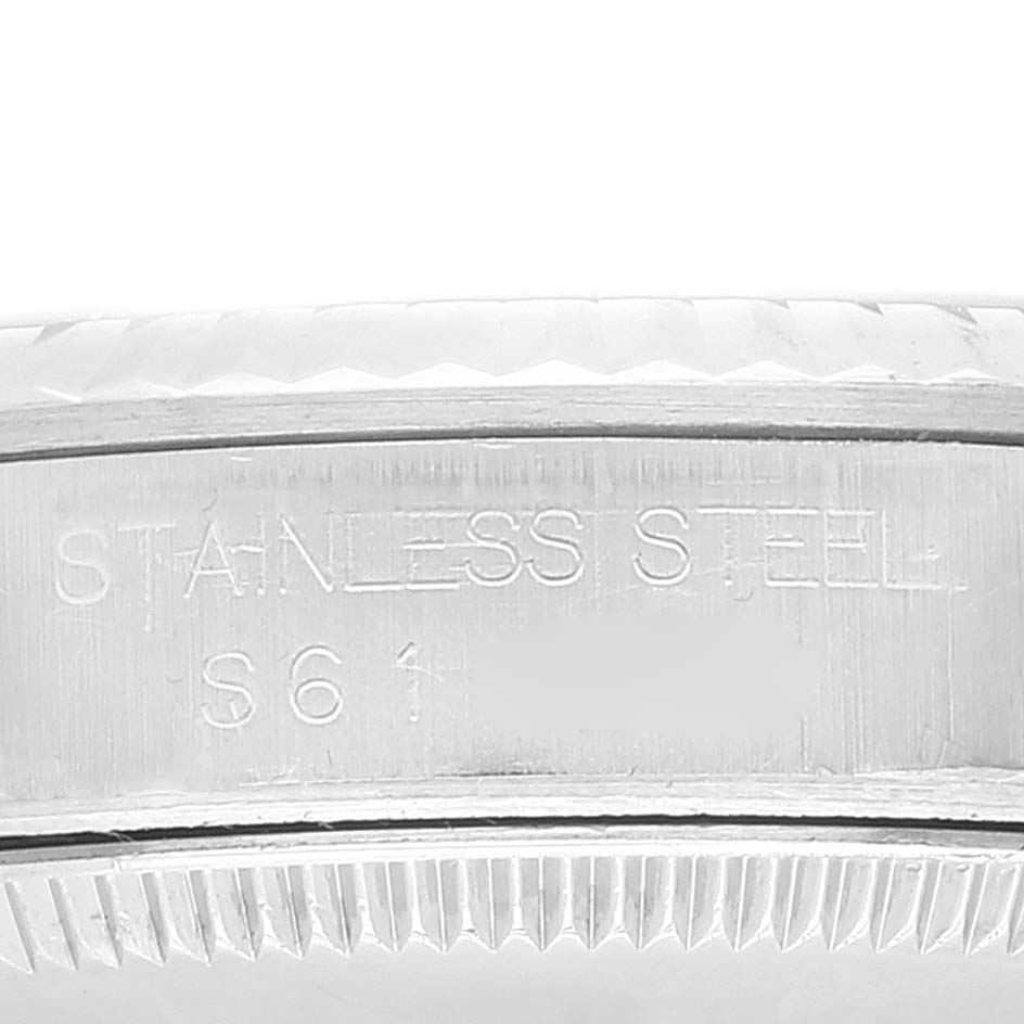 This is an image of the side profile of a Rolex Mid-Size 67514 Women
s Stainless Steel Blue Dial 67514 Women
s Stainless Steel Blue Dial model watch, showcasing the stainless steel engraving on the case.