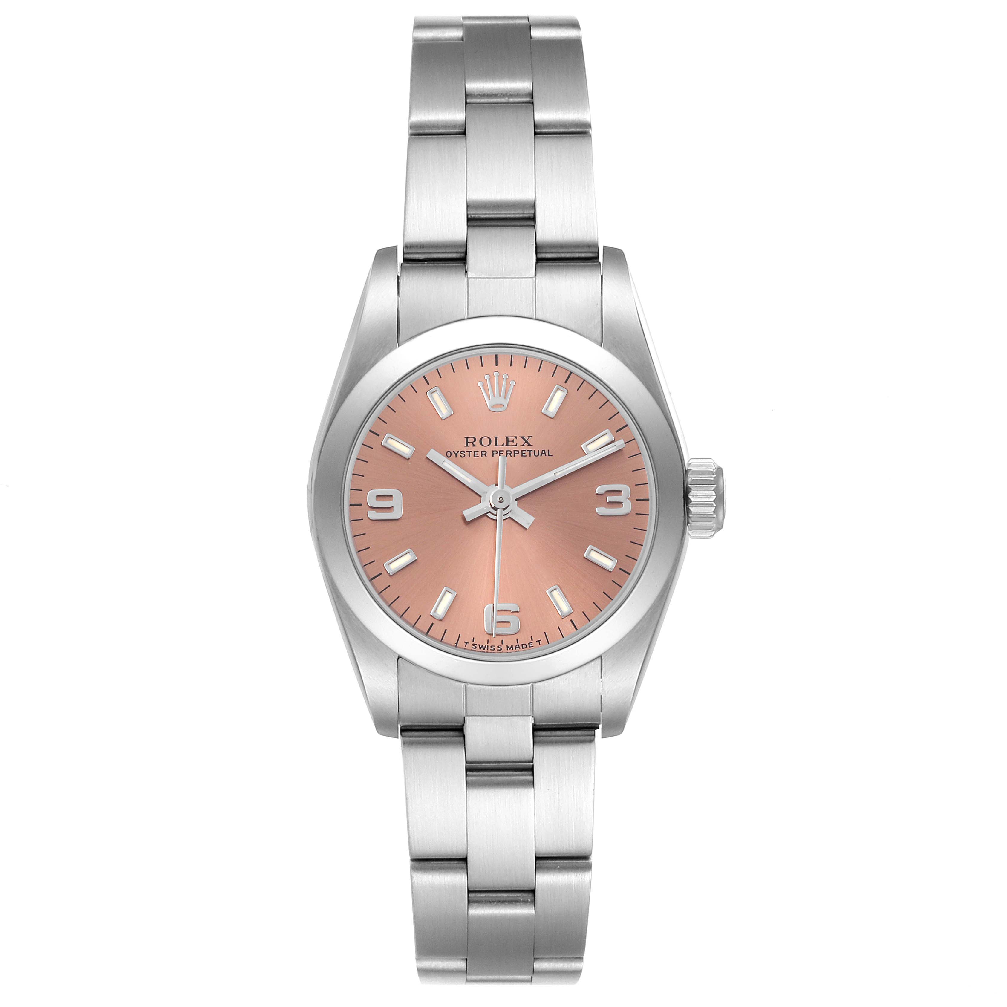 The image shows a front view of a Rolex Oyster Perpetual 67180 Women
s Stainless Steel Pink Dial 67180 Women
s Stainless Steel Pink Dial watch with a pink dial and stainless steel bracelet.