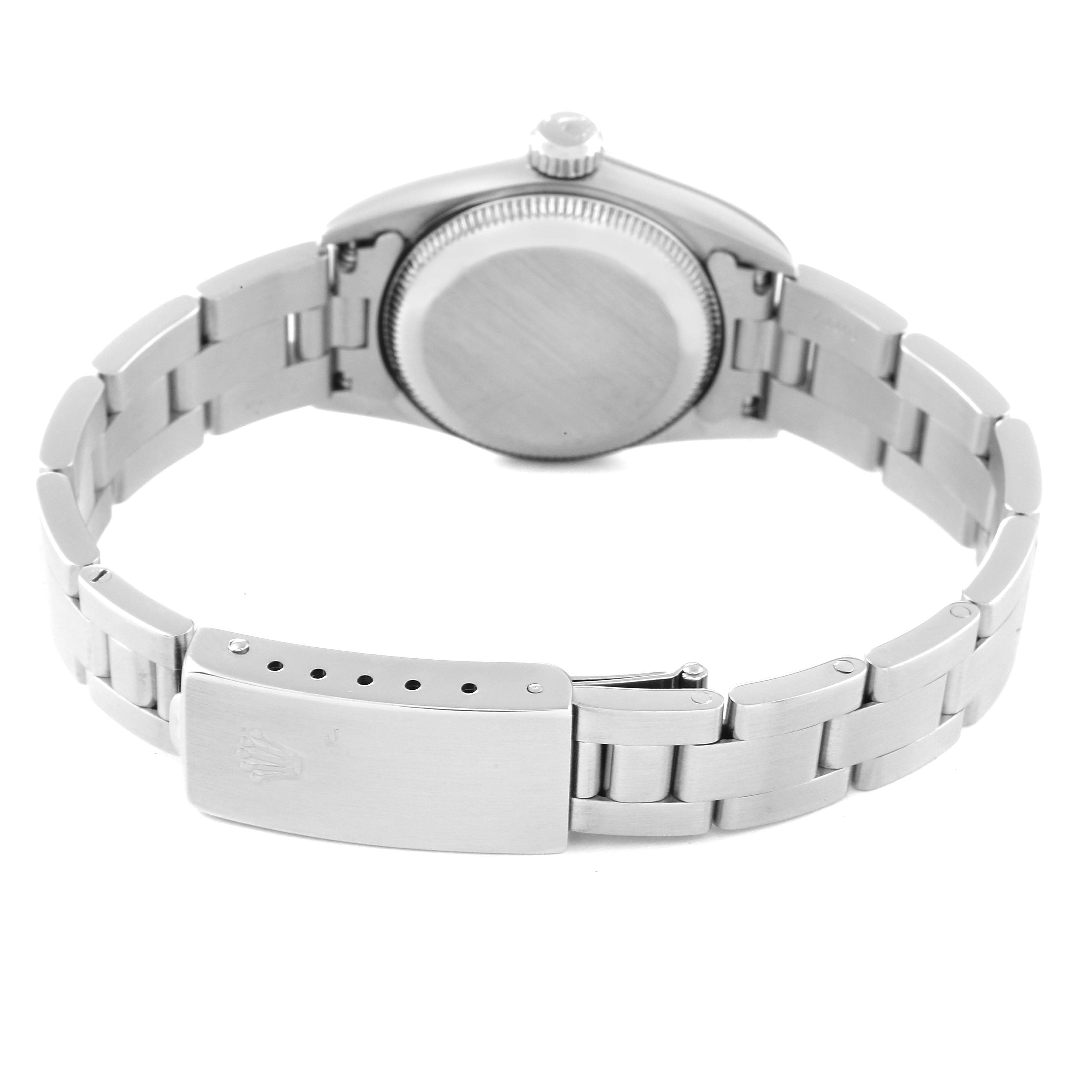 The image shows the back view of a Rolex Oyster Perpetual 67180 Women
s Stainless Steel Pink Dial 67180 Women
s Stainless Steel Pink Dial watch, highlighting the case back and clasp of the bracelet.