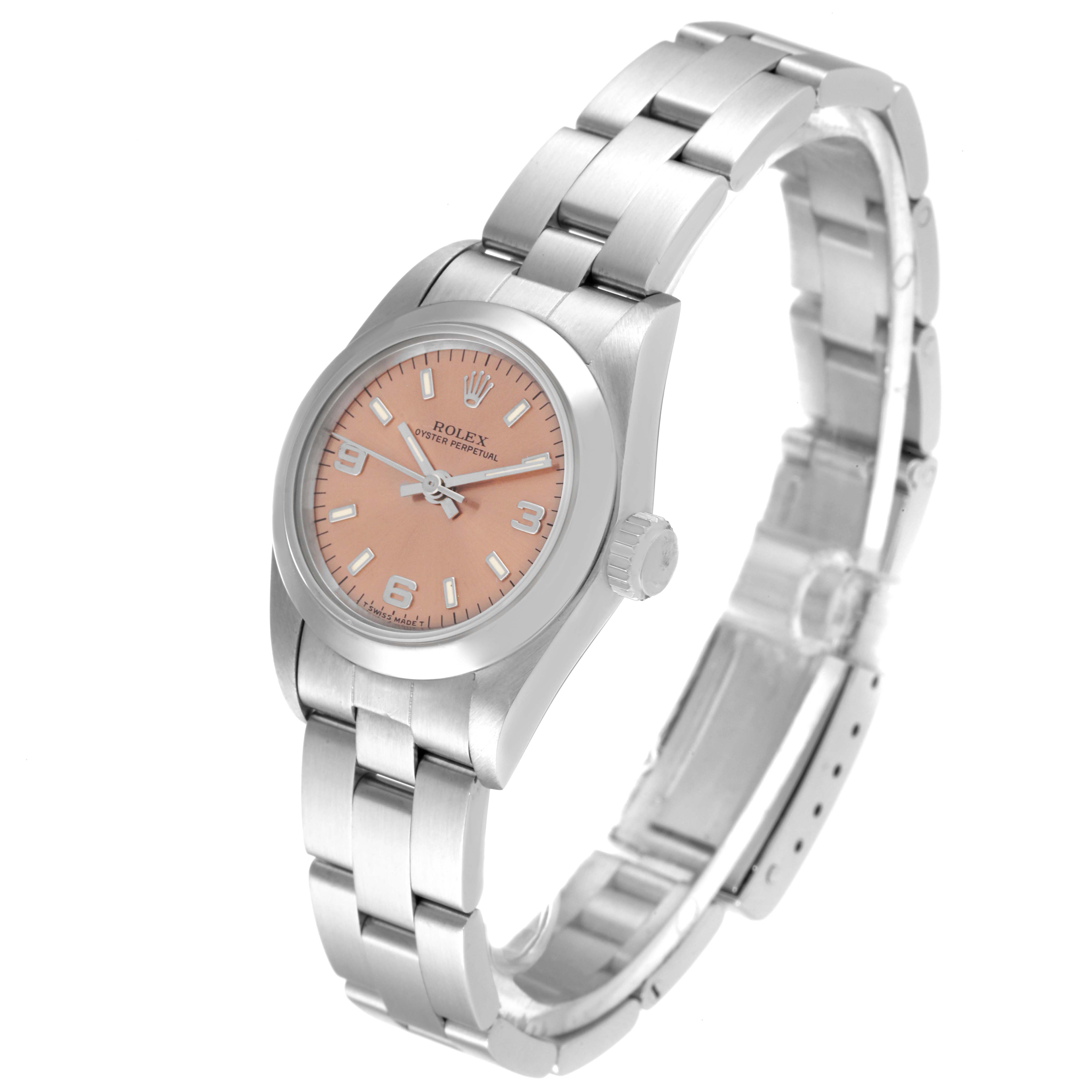 The image shows a Rolex Oyster Perpetual 67180 Women
s Stainless Steel Pink Dial 67180 Women
s Stainless Steel Pink Dial watch angled to display its face, case, crown, and bracelet links.