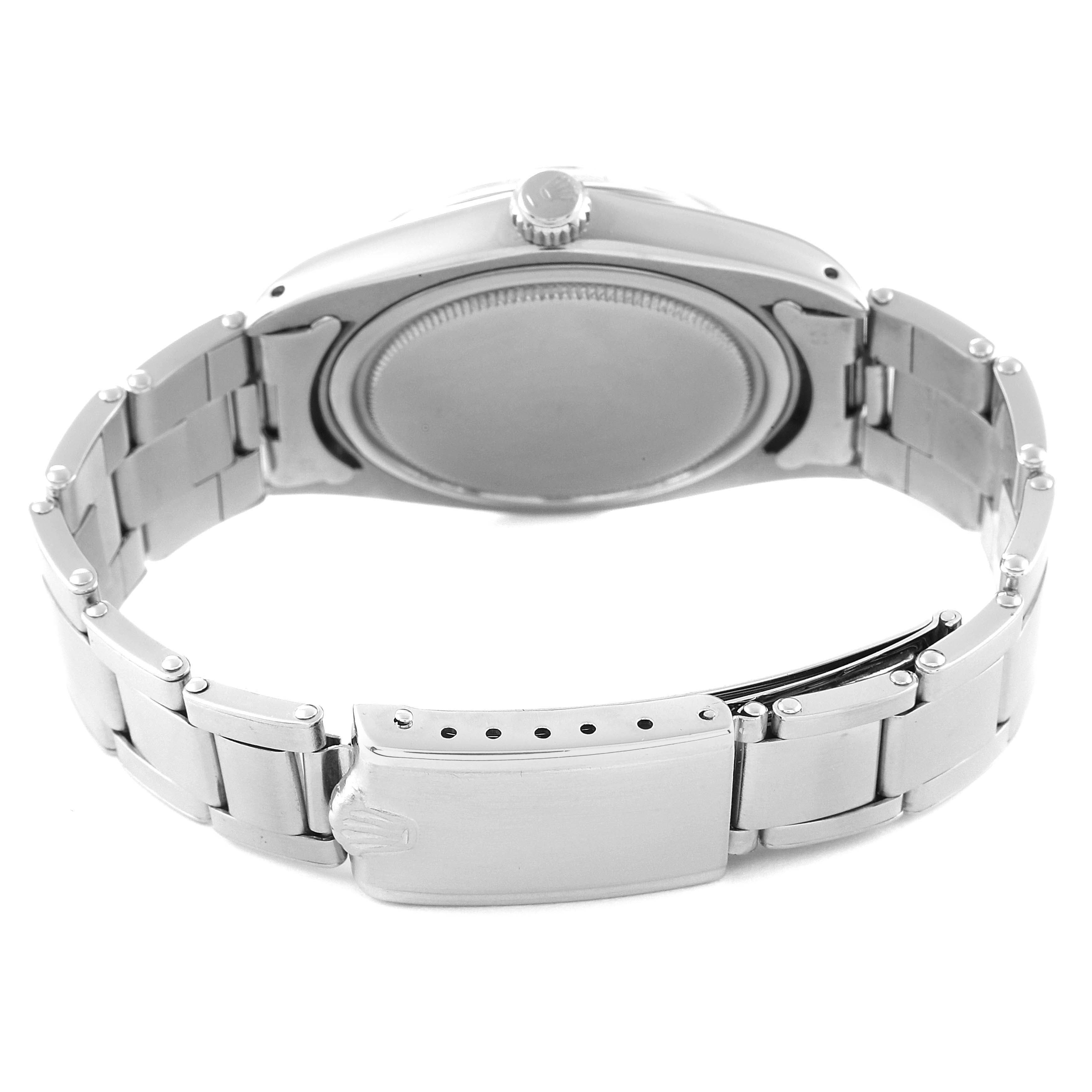 This image shows the back view of a Rolex Vintage Collection 6694 Men's Stainless Steel Silver Dial 6694 Men's Stainless Steel Silver Dial watch, featuring its caseback and bracelet clasp.