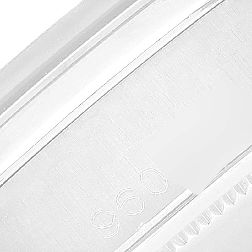 This is a close-up of the engraved inside bezel of a Rolex Vintage Collection 6694 Men's Stainless Steel Silver Dial 6694 Men's Stainless Steel Silver Dial model, showing partial serial or model numbers.