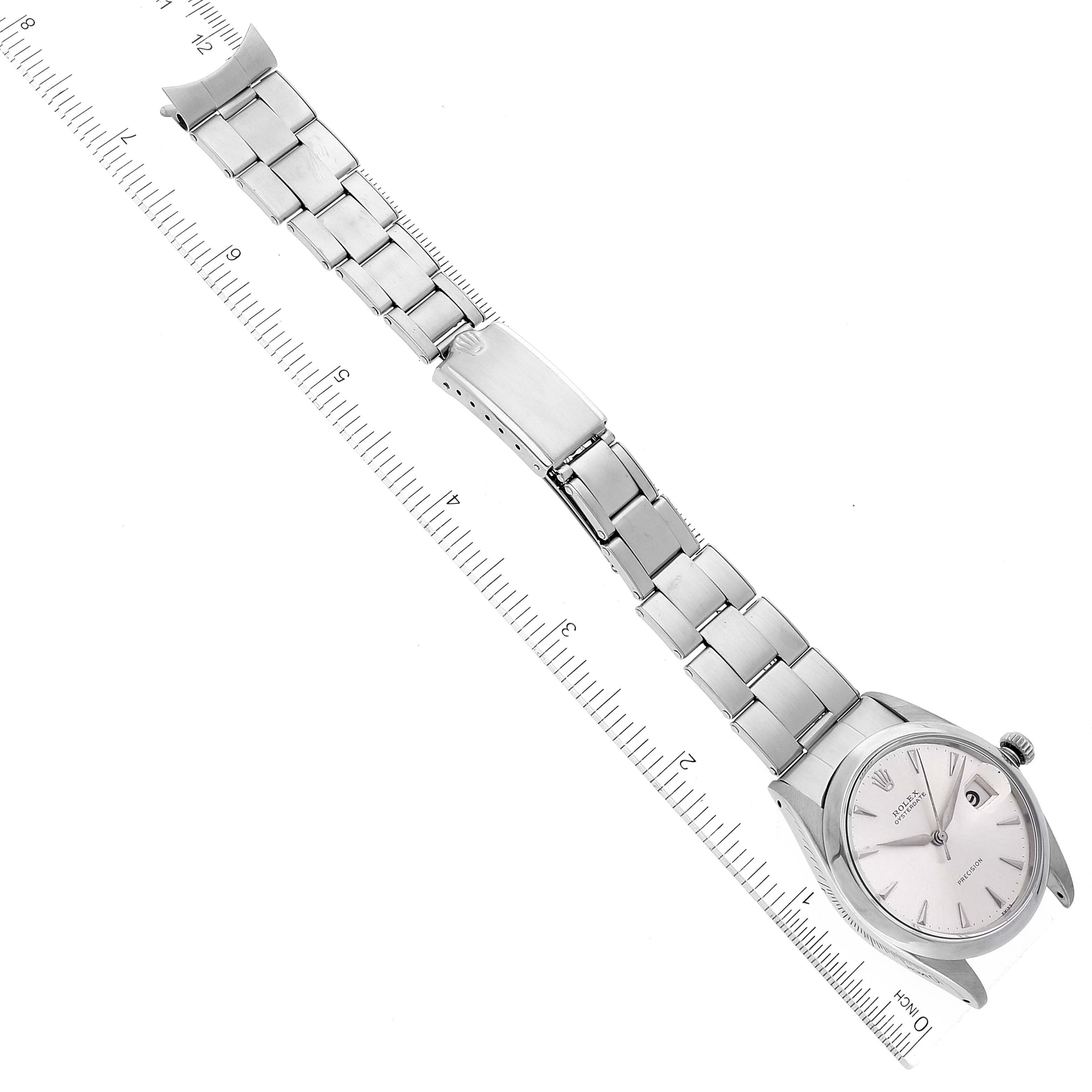 The image shows a top-down view of the Rolex Vintage Collection 6694 Men's Stainless Steel Silver Dial 6694 Men's Stainless Steel Silver Dial model watch focusing on the face and metal bracelet.