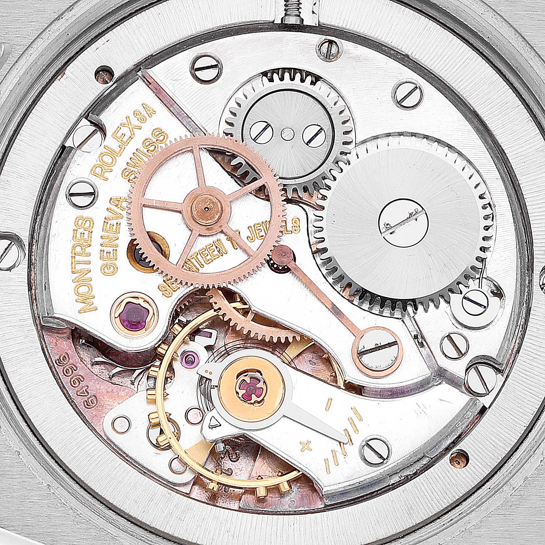 The image shows the intricate internal mechanics and gears of a Vintage Collection model by Rolex from the back view.