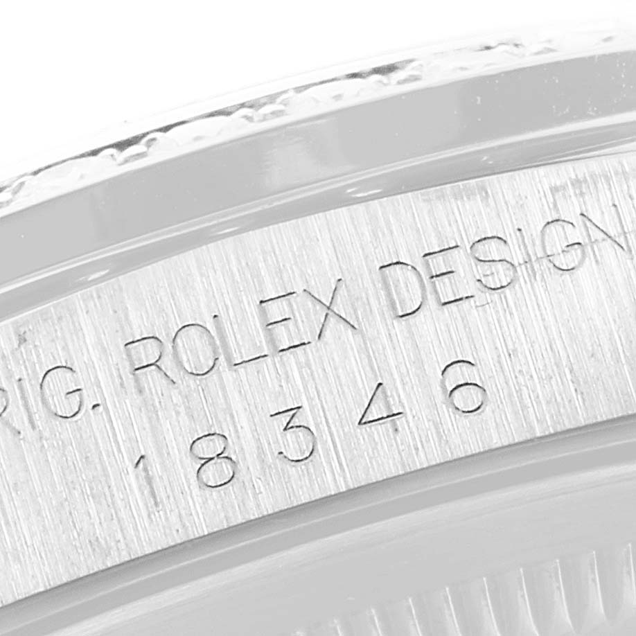 This image shows a close-up of the engraved serial number on the case of a Rolex President 18346 Men's Platinum Blue Dial 18346 Men's Platinum Blue Dial model watch.