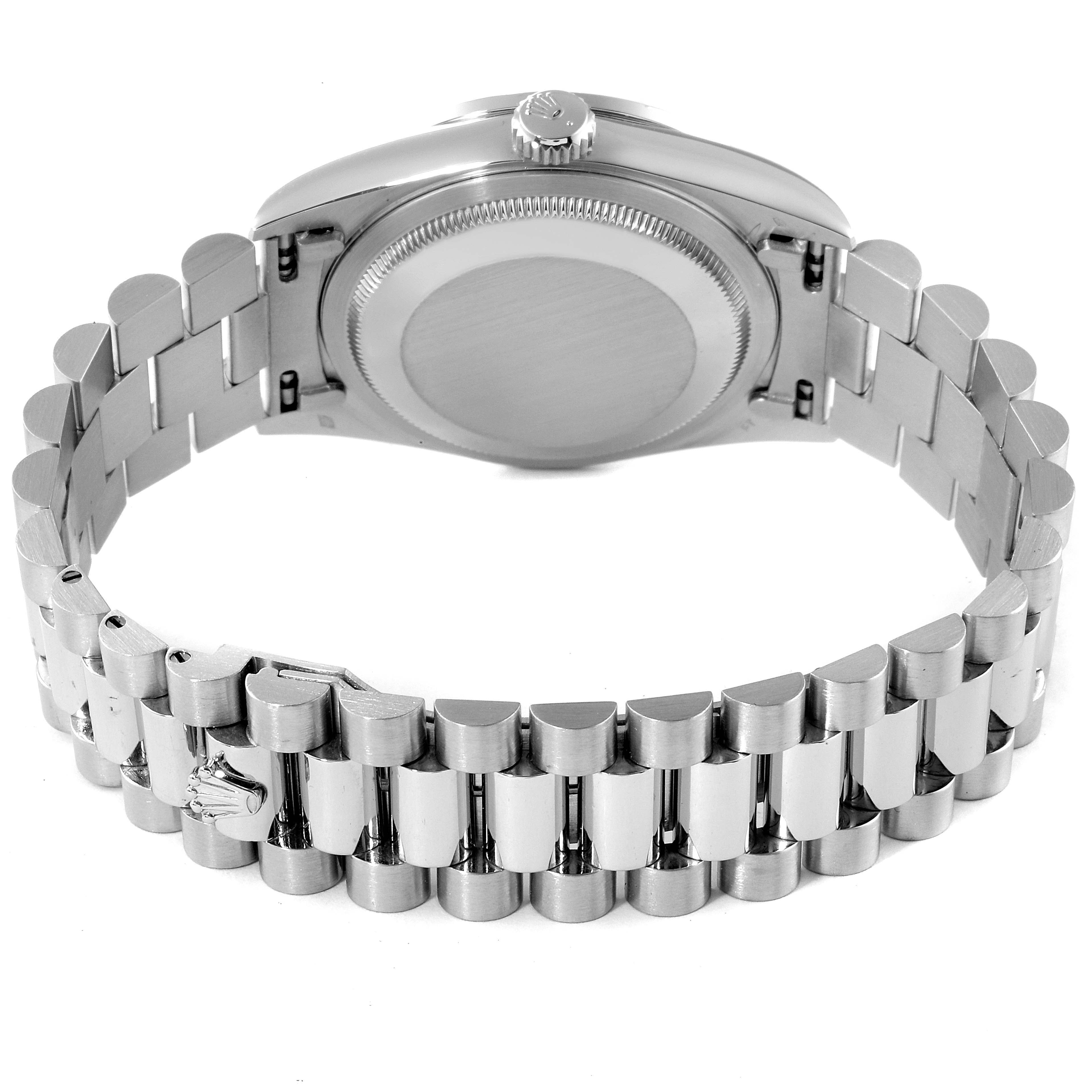 The image shows the backside of a Rolex President 18346 Men's Platinum Blue Dial 18346 Men's Platinum Blue Dial model watch, highlighting the case back and the bracelet.