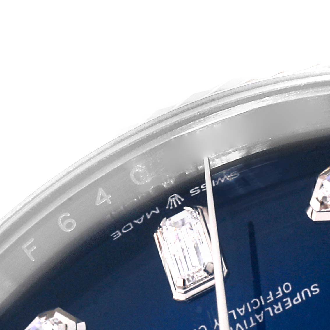 This close-up angle of the Rolex President 128239 Men's White Gold Blue Dial 128239 Men's White Gold Blue Dial watch shows part of the dial, including diamond markers and the "Swiss Made" text.