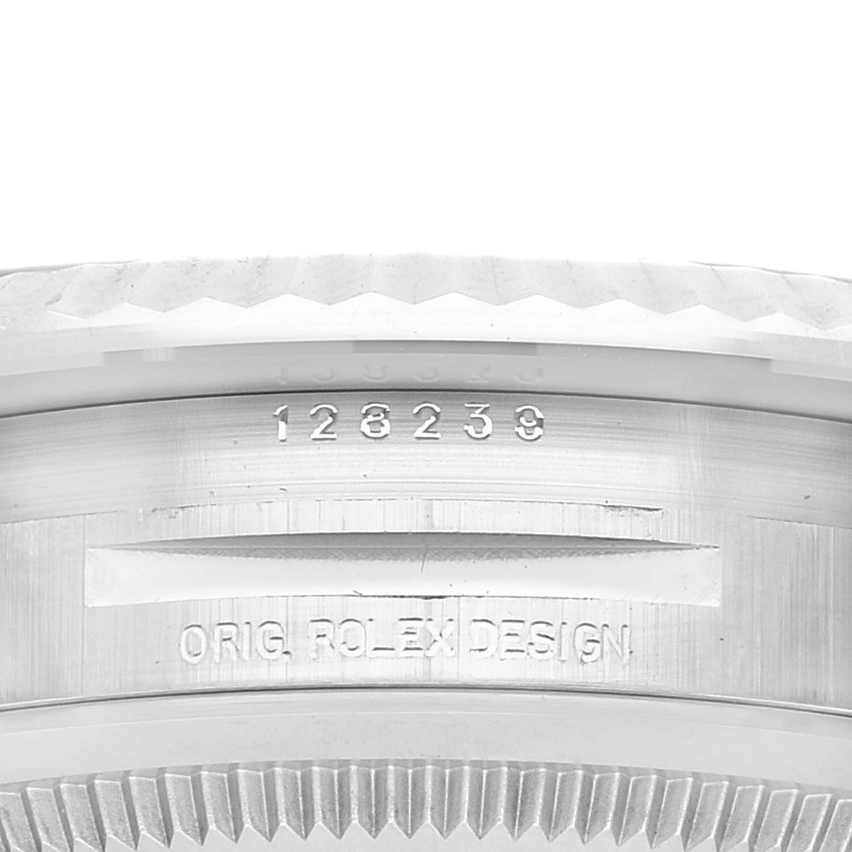 This close-up image shows the side of the bezel and case with serial number of a Rolex President 128239 Men's White Gold Blue Dial 128239 Men's White Gold Blue Dial model watch.