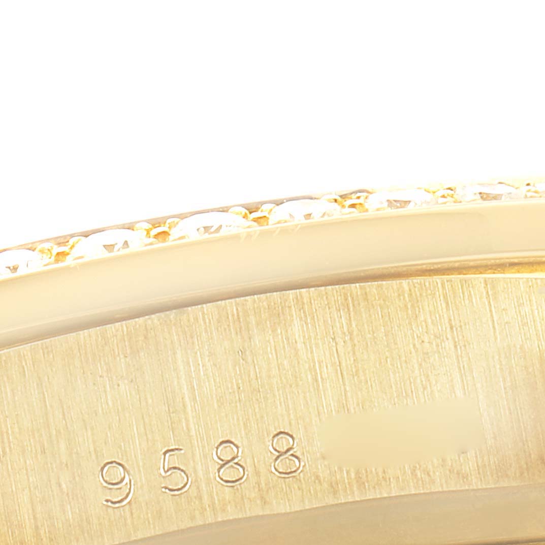 This image shows the side view of a Rolex President 18048 Men
s Yellow Gold Champagne Dial 18048 Men
s Yellow Gold Champagne Dial model, focusing on the bezel and part of the case with serial number engraving.