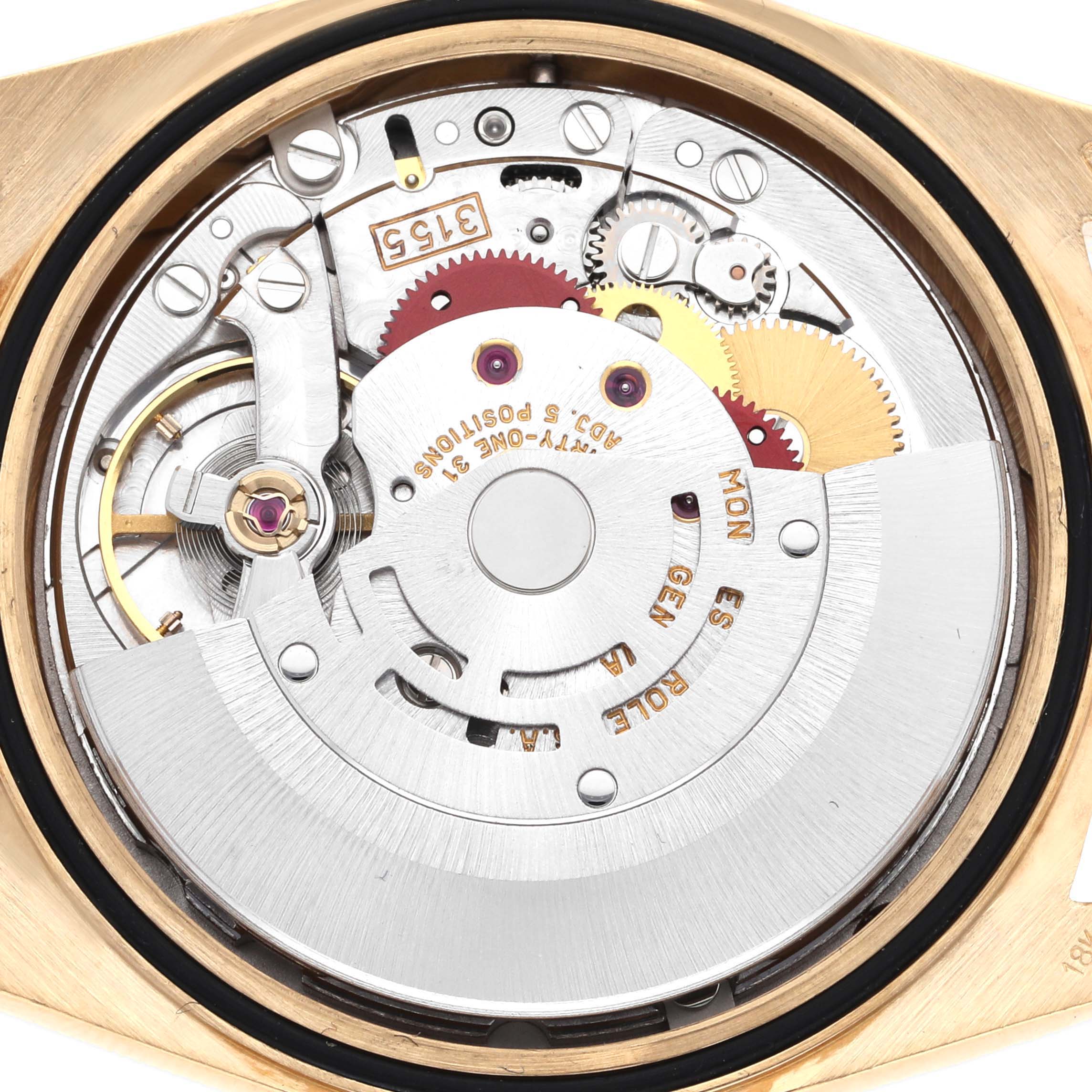 The image shows the internal mechanism of a Rolex President 18238 Men
s Yellow Gold Champagne Dial 18238 Men
s Yellow Gold Champagne Dial model watch from a top-down angle, displaying gears and movement components.