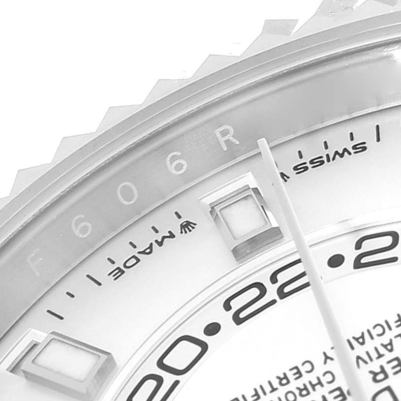 This close-up image of a Rolex Sky-Dweller 336934 Men
s Stainless Steel White Dial 336934 Men
s Stainless Steel White Dial watch features the bezel, part of the dial, and hour markers.