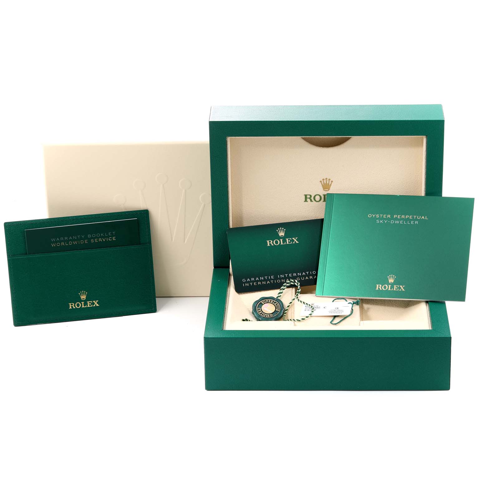 The image shows the packaging, manuals, warranty booklets, and tags for the Rolex Sky-Dweller 336934 Men
s Stainless Steel White Dial 336934 Men
s Stainless Steel White Dial, with the box open and the contents displayed.