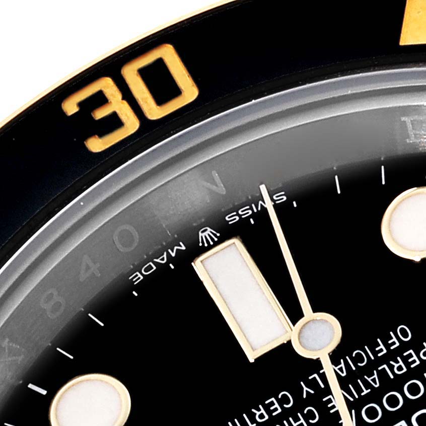The image shows a close-up angle of the upper section of a Rolex Submariner 126613LN Men's Steel and Gold (two tone) Black Dial 126613LN Men's Steel and Gold (two tone) Black Dial watch dial, specifically the "30" marker on its bezel and parts of the dial.