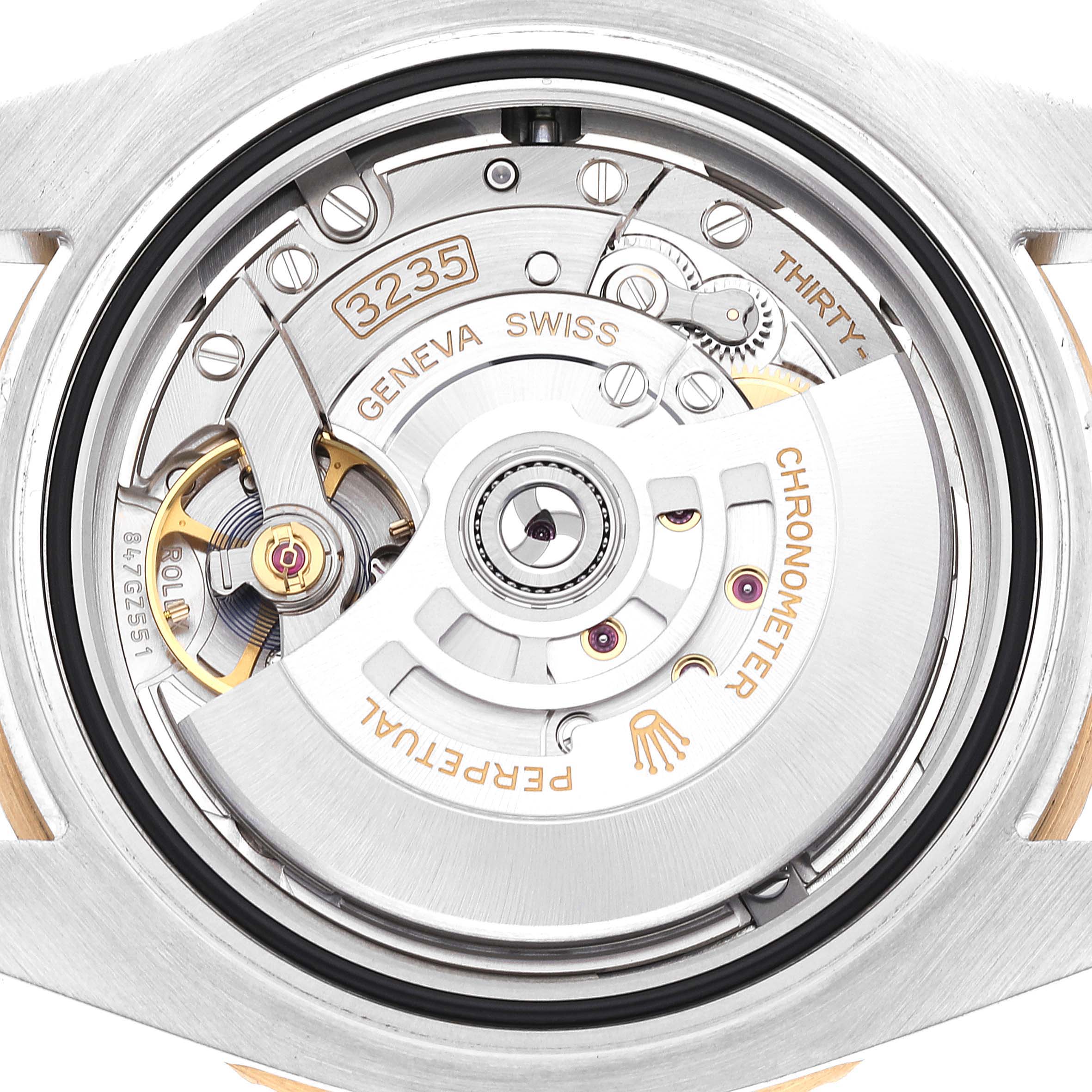 This image shows a close-up of the intricate movement and inner mechanism of a Rolex Submariner 126613LN Men's Steel and Gold (two tone) Black Dial 126613LN Men's Steel and Gold (two tone) Black Dial watch.