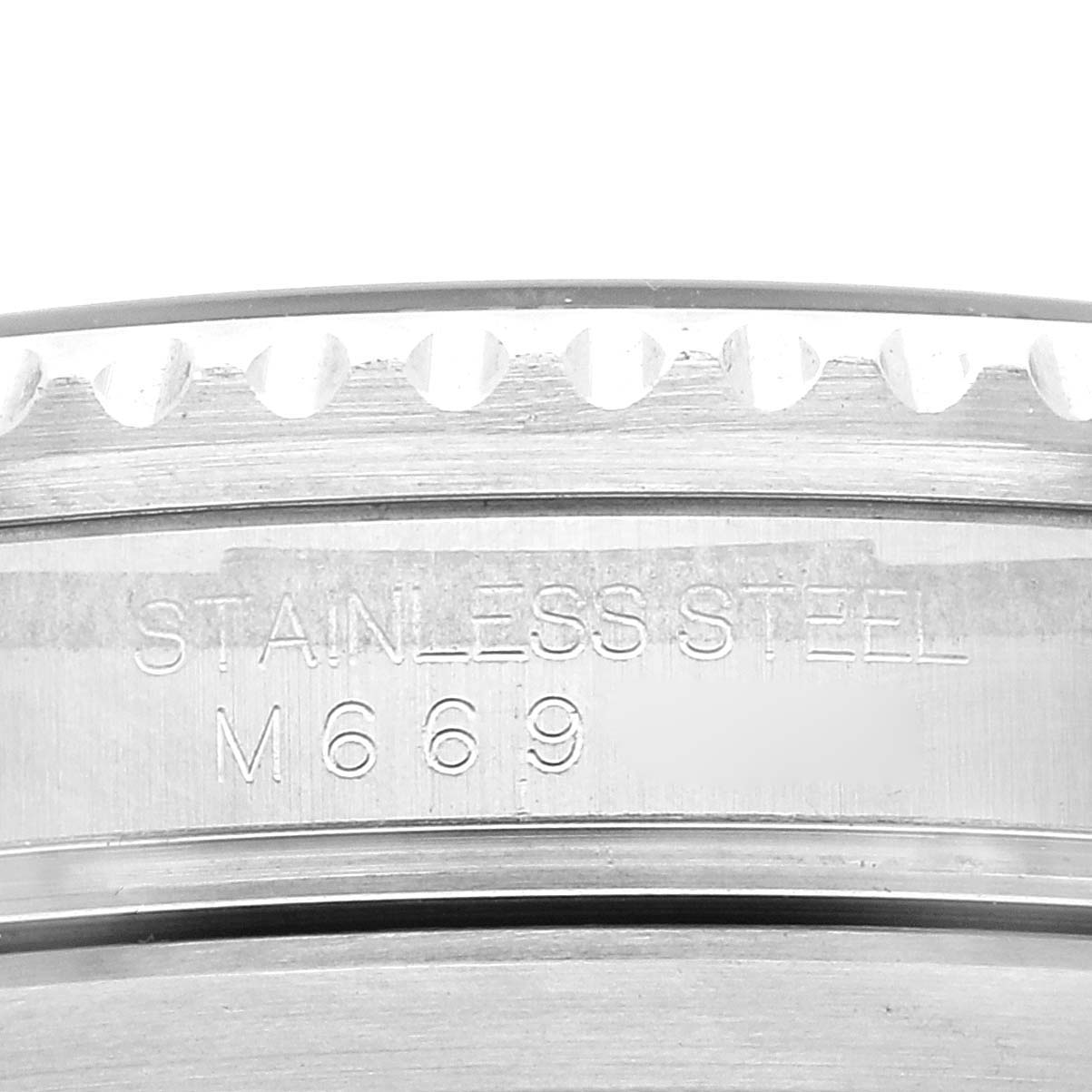 This close-up image focuses on the stainless steel engraving on the bezel of a Rolex Submariner 16610 Men
s Stainless Steel Black Dial 16610 Men
s Stainless Steel Black Dial watch.