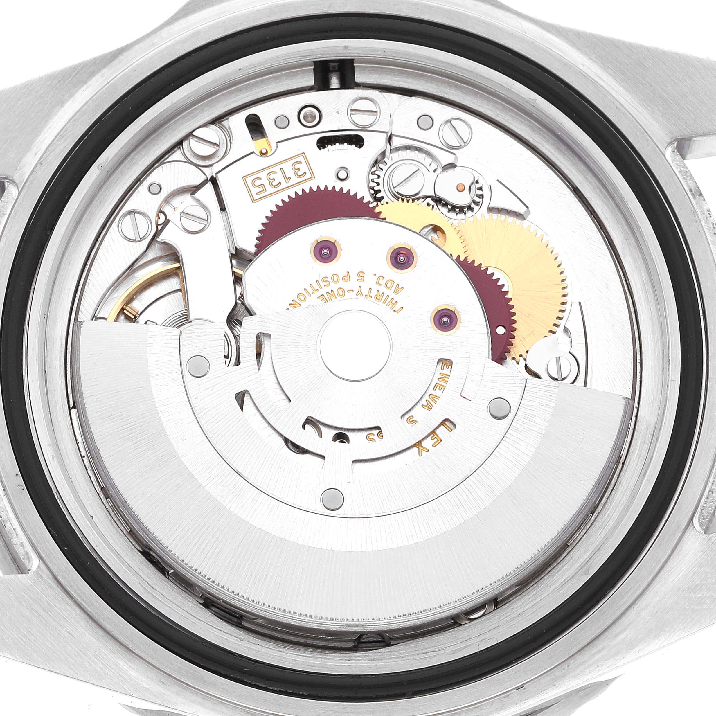 This image shows the back view of the Rolex Submariner 16610 Men
s Stainless Steel Black Dial 16610 Men
s Stainless Steel Black Dial watch, highlighting its intricate movement and inner mechanisms.