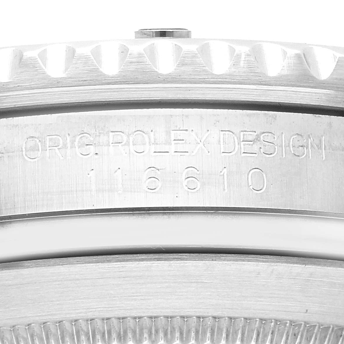 The image shows a close-up of the engravings and bezel edge on a Rolex Submariner 116610LV Men
s Stainless Steel Green Dial 116610LV Men
s Stainless Steel Green Dial watch, highlighting its model number 116610.