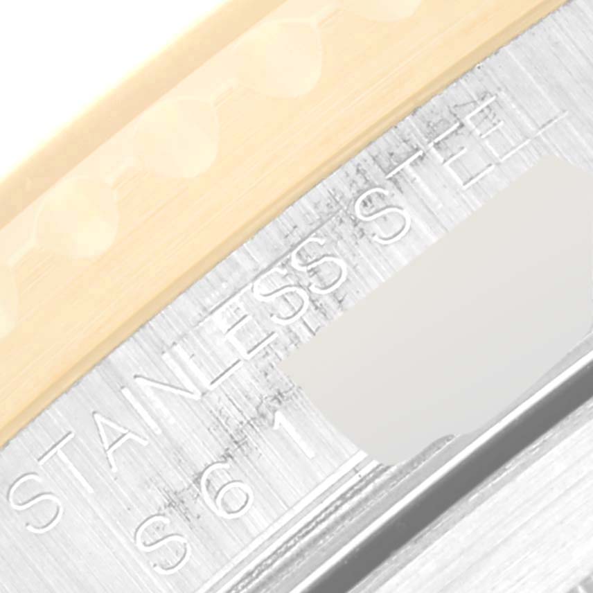 This close-up image shows the side engraving and part of the bezel of a Rolex Submariner 16613 Men
s Steel and Gold (two tone) Black Dial 16613 Men
s Steel and Gold (two tone) Black Dial watch.