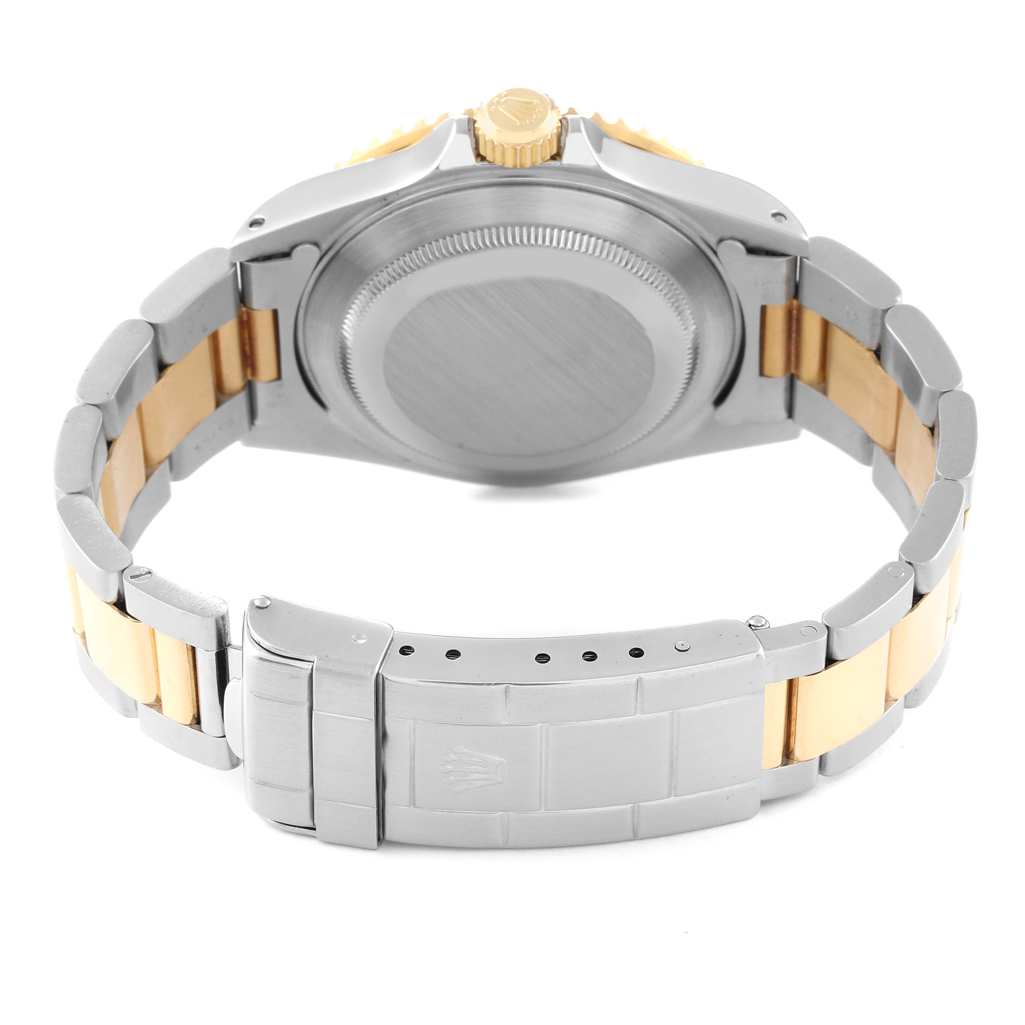 The image shows the back and bracelet of a Rolex Submariner 16613 Men
s Steel and Gold (two tone) Black Dial 16613 Men
s Steel and Gold (two tone) Black Dial watch, focusing on the case back and clasp.