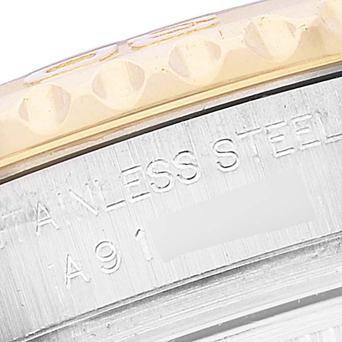 The image shows a close-up of the side of a Rolex Yacht-Master 169623 Women's Steel and Gold (two tone) Blue Dial 169623 Women's Steel and Gold (two tone) Blue Dial watch, highlighting the stainless steel part with engraved text.