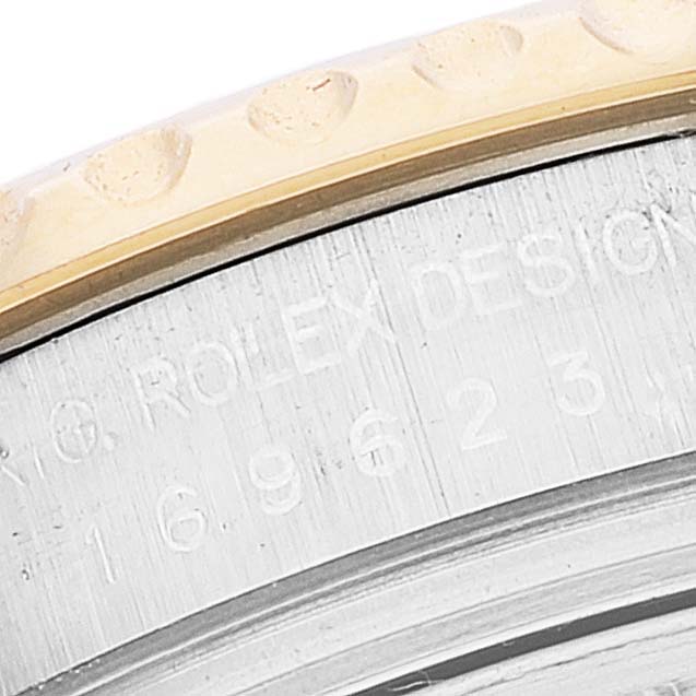 The image shows a close-up angle of the bezel and part of the case with engravings on a Rolex Yacht-Master 169623 Women's Steel and Gold (two tone) Blue Dial 169623 Women's Steel and Gold (two tone) Blue Dial watch.