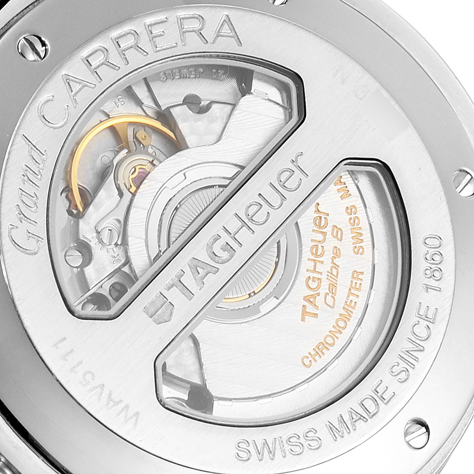 This image shows the back side of the Tag Heuer Carrera WAV5111.BA0901 Men
s Stainless Steel Black Dial WAV5111.BA0901 Men
s Stainless Steel Black Dial watch, highlighting its internal mechanism and inscriptions.