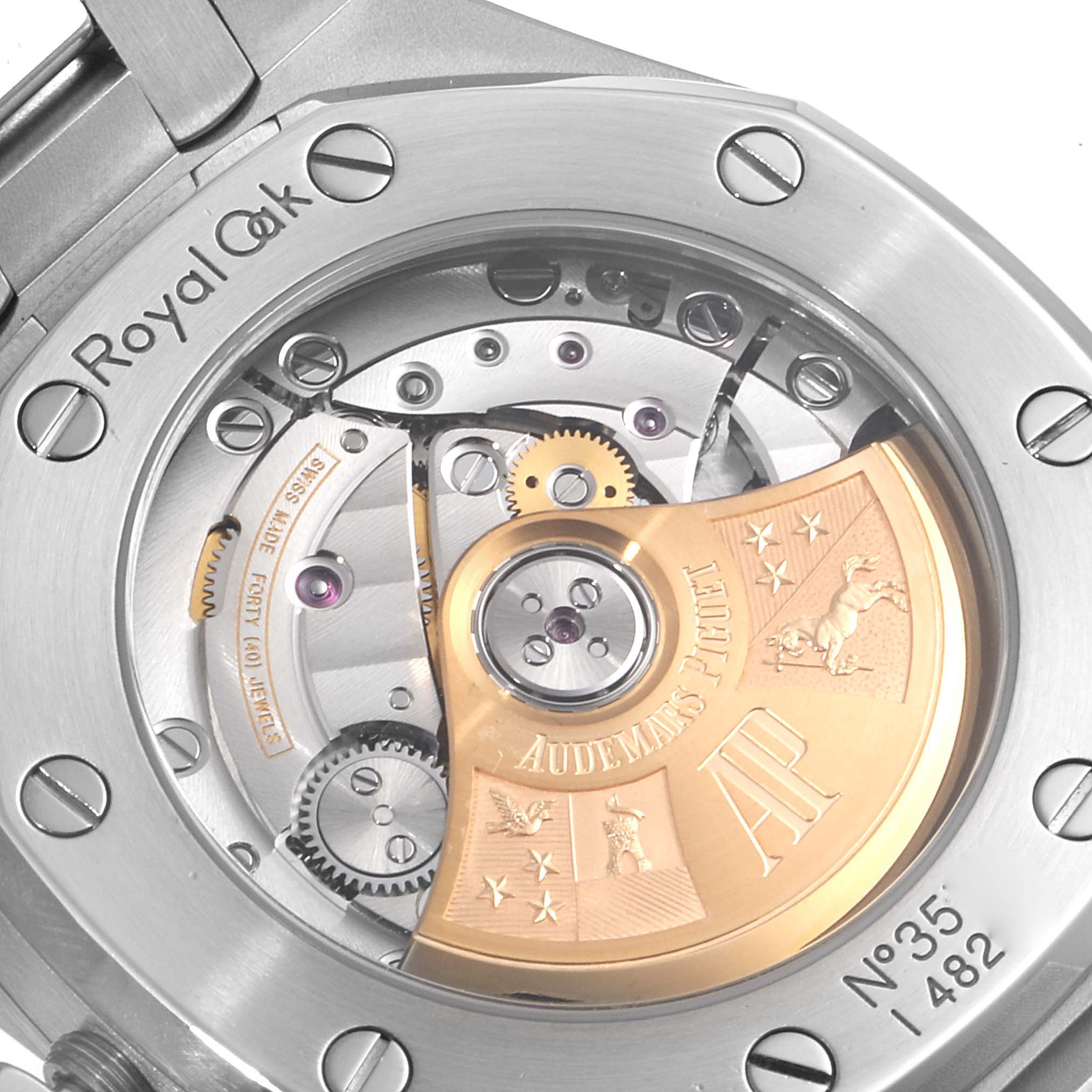 The image shows the back view of an Audemars Piguet Royal Oak 15451ST.ZZ.1256ST.01 Men's Stainless Steel Black Dial 15451ST.ZZ.1256ST.01 Men's Stainless Steel Black Dial watch, highlighting its intricate mechanical movement and rotor.