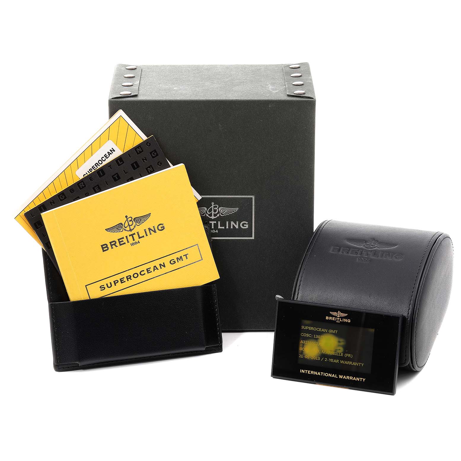 The image shows the packaging, warranty, and manuals for the Breitling Superocean A32380 Men's Stainless Steel Black Dial A32380 Men's Stainless Steel Black Dial GMT watch.