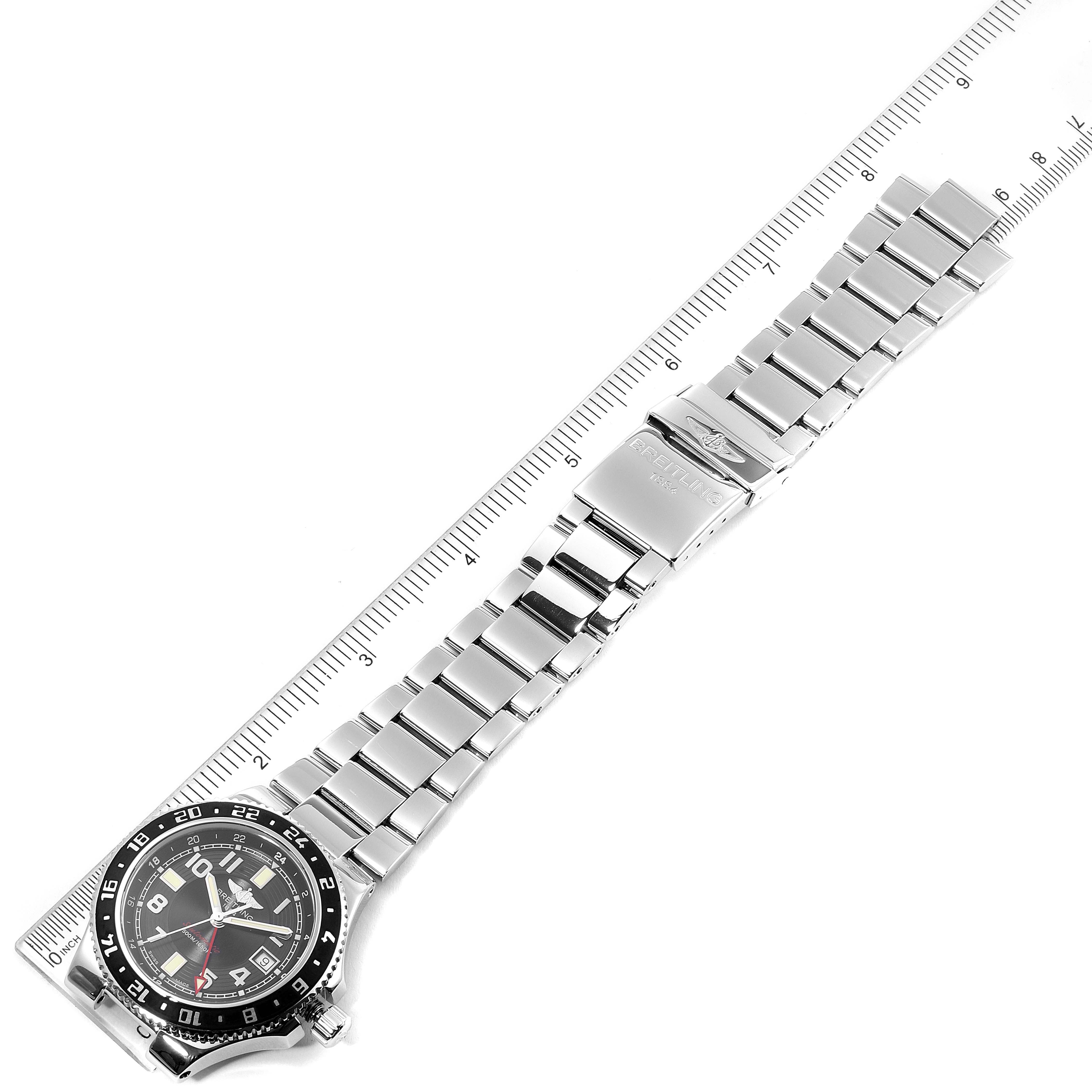 The image shows a Breitling Superocean A32380 Men's Stainless Steel Black Dial A32380 Men's Stainless Steel Black Dial watch laid flat with its bracelet extended and measured against a ruler.