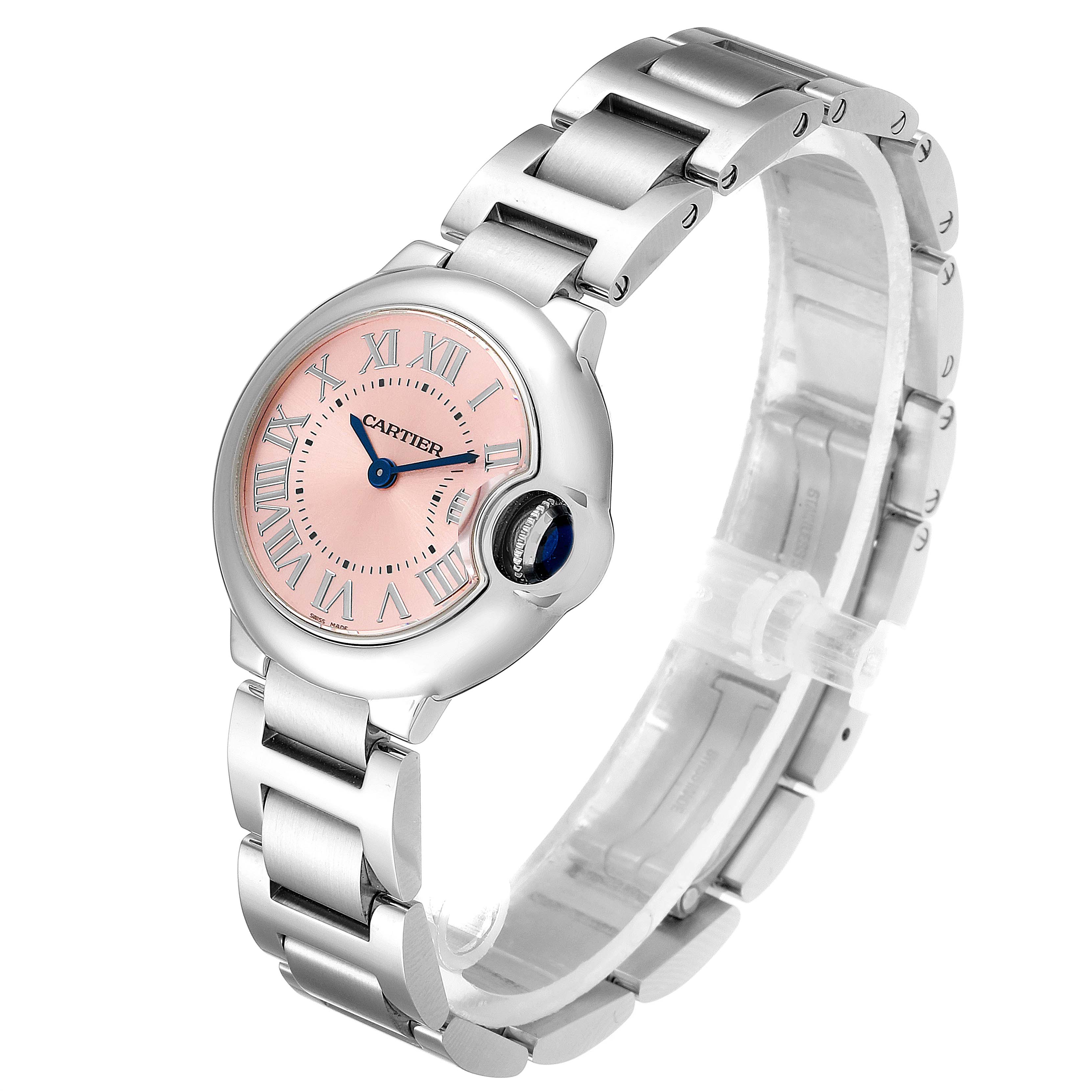 The Cartier Ballon Bleu W6920038 Women
s Stainless Steel Pink Dial W6920038 Women
s Stainless Steel Pink Dial watch is shown at a three-quarter angle, displaying its pink dial, Roman numerals, and metal bracelet.