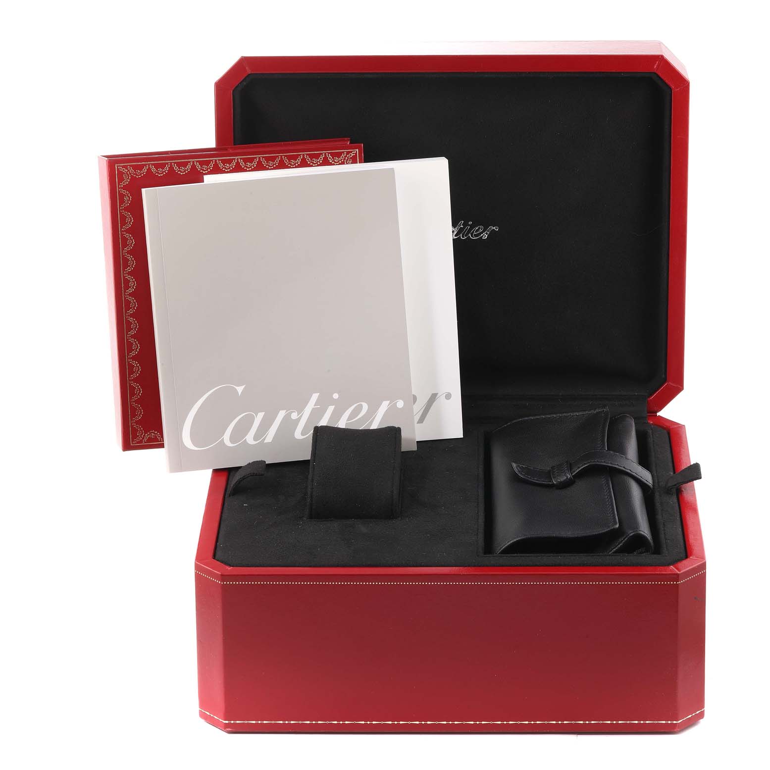 This image shows a Cartier Roadster W62020X6 Men's Stainless Steel Black Dial W62020X6 Men's Stainless Steel Black Dial watch box set containing manuals and accessory pouches, viewed from above.