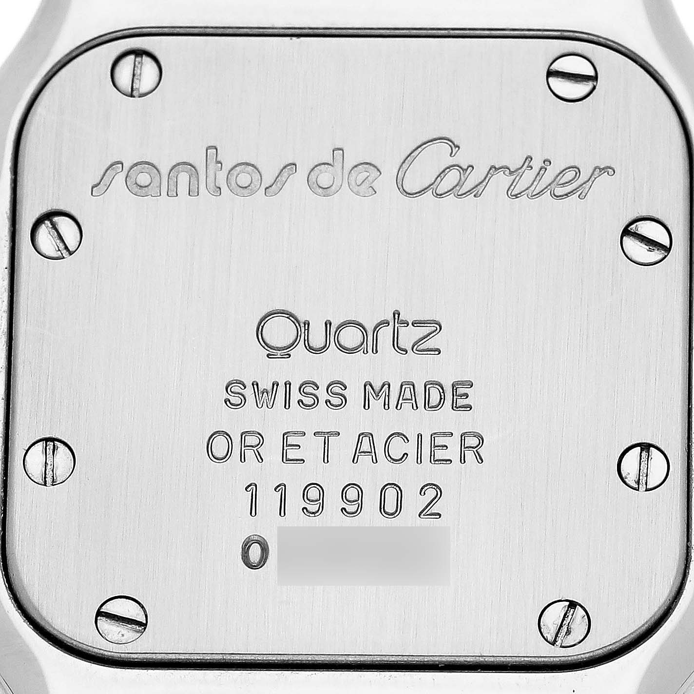 The image shows the back case of a Cartier Santos W20008C4 Women's Steel and Gold (two tone) Silver Dial watch, displaying screws and engraved text.