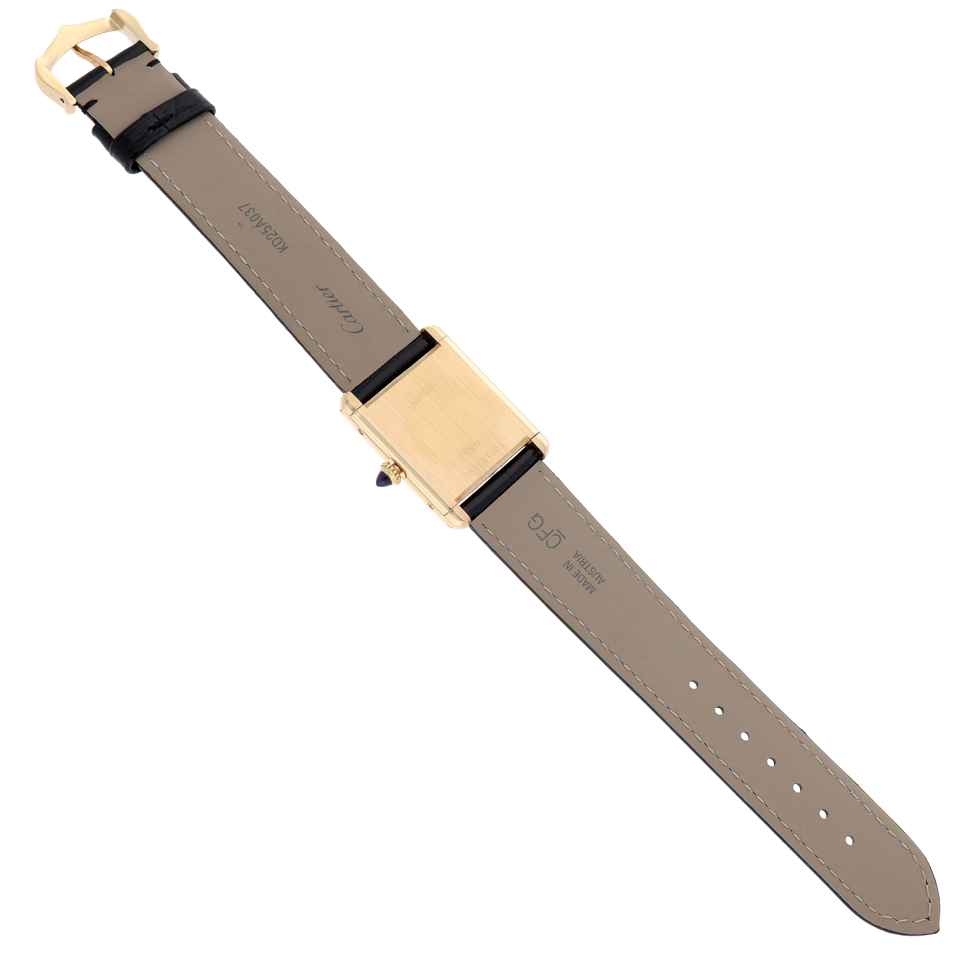 The Cartier Tank Classic Women's Yellow Gold White Dial watch is shown from the back, highlighting the strap and case.