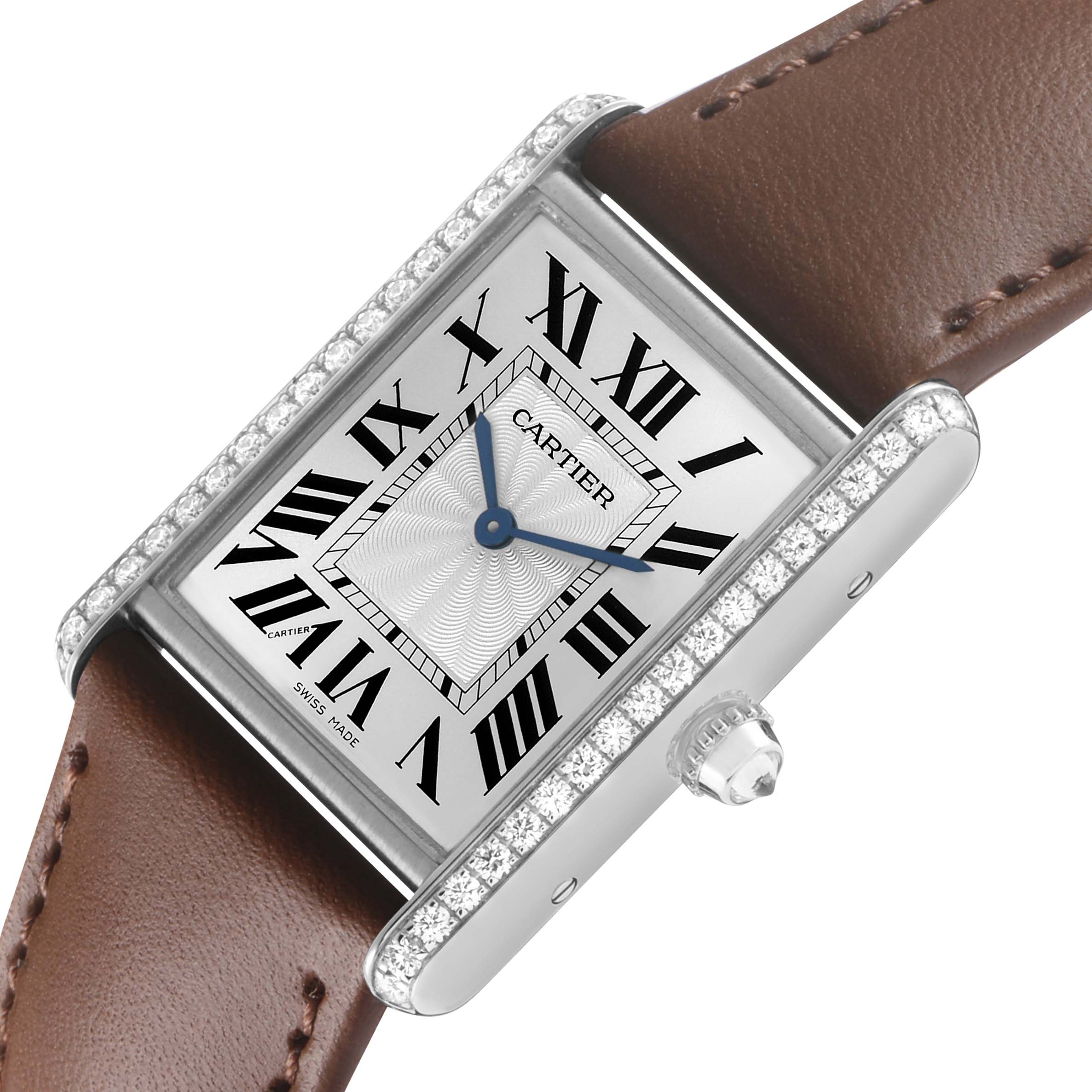 The Cartier Tank Louis WJTA0015 Women's White Gold Silver Dial watch is shown at a slight angle, highlighting the rectangular face, roman numerals, and jeweled bezel.