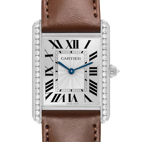 The Cartier Tank Louis WJTA0015 Women's White Gold Silver Dial watch is shown from the front, highlighting the Roman numeral dial, blue hands, brown leather strap, and diamond-set bezel.