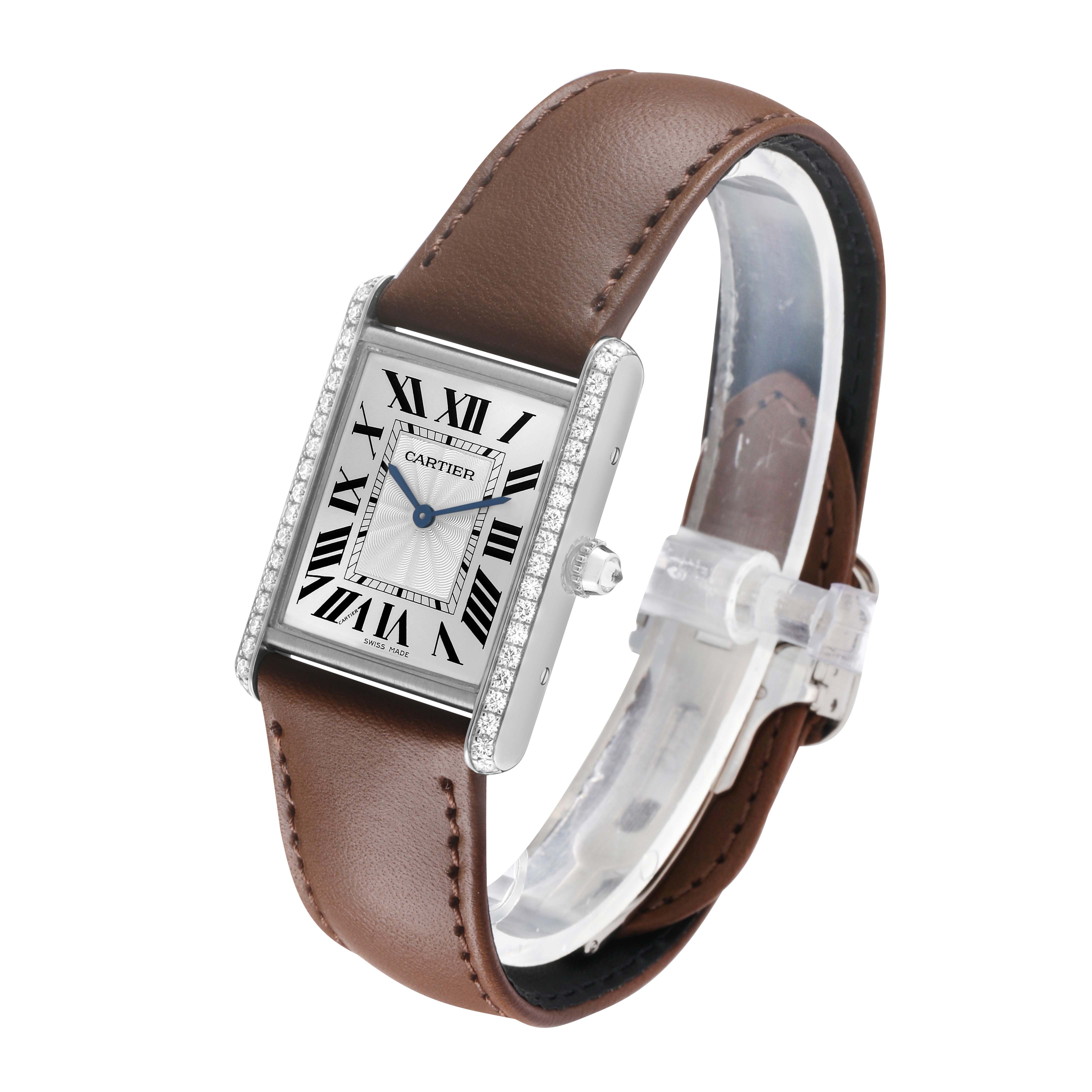The Cartier Tank Louis WJTA0015 Women's White Gold Silver Dial watch is shown at a three-quarter angle, displaying the face, bezel, crown, and brown leather strap.