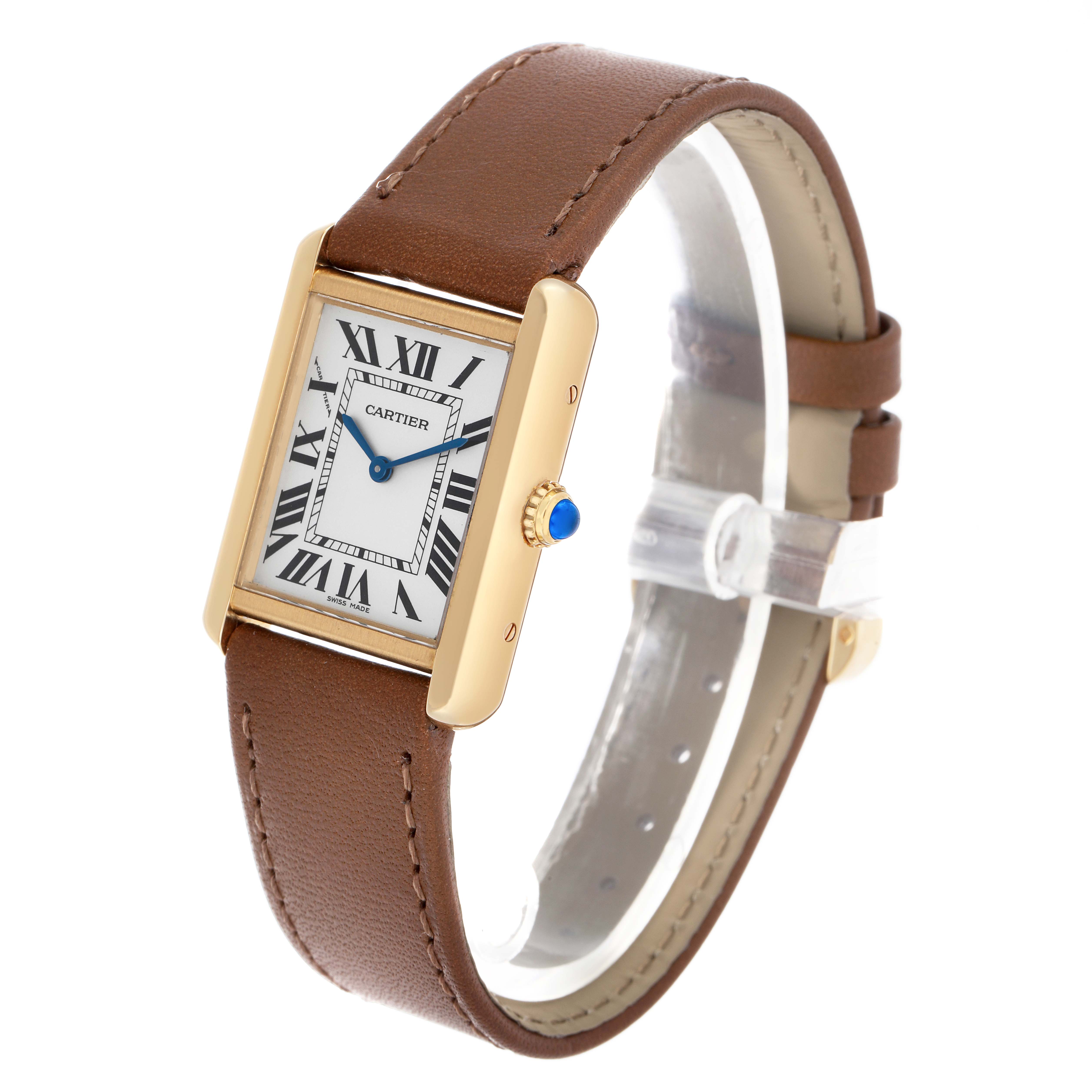 The Cartier Tank Solo W5200002 Women's Yellow Gold Silver Dial watch is shown at an oblique angle, highlighting the face, leather strap, and blue cabochon crown.