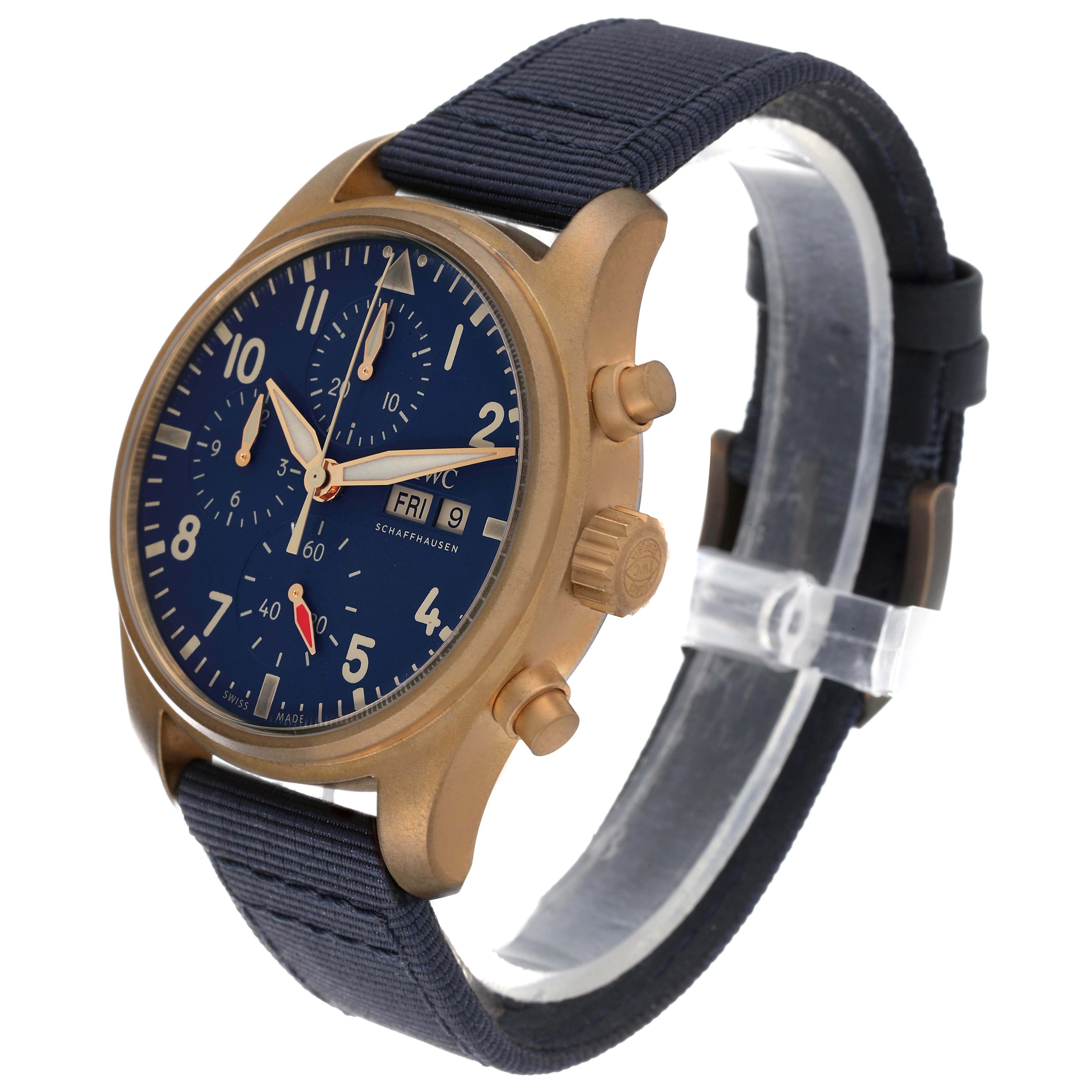 The IWC Pilot IW388109 Men's Bronze Blue Dial IW388109 Men's Bronze Blue Dial watch is shown in a three-quarter view, highlighting the face, crown, chronograph buttons, and strap.