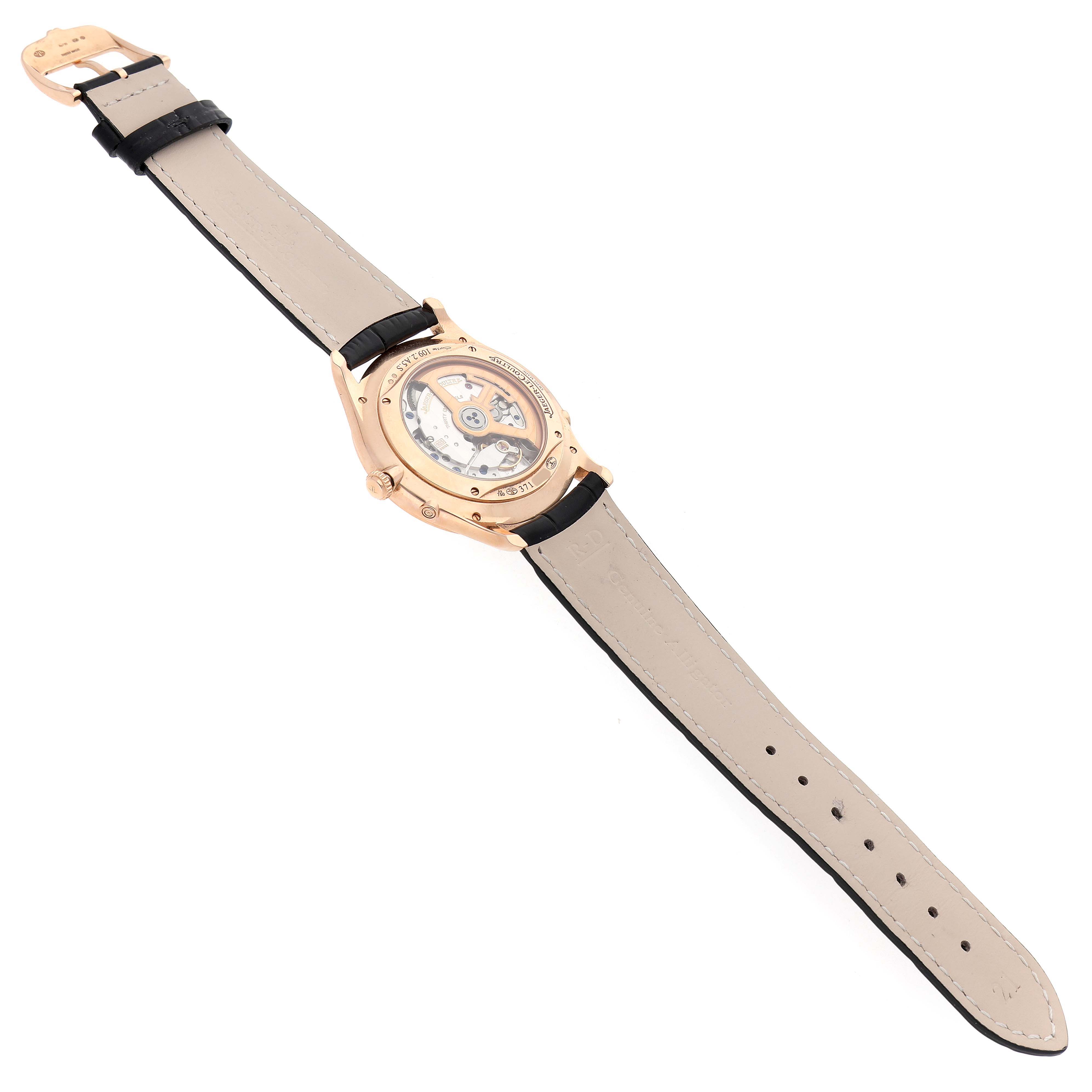 The Jaeger LeCoultre Master Q1362580 Men's Rose Gold Blue Dial watch is shown from the back, highlighting the open case back and leather strap.