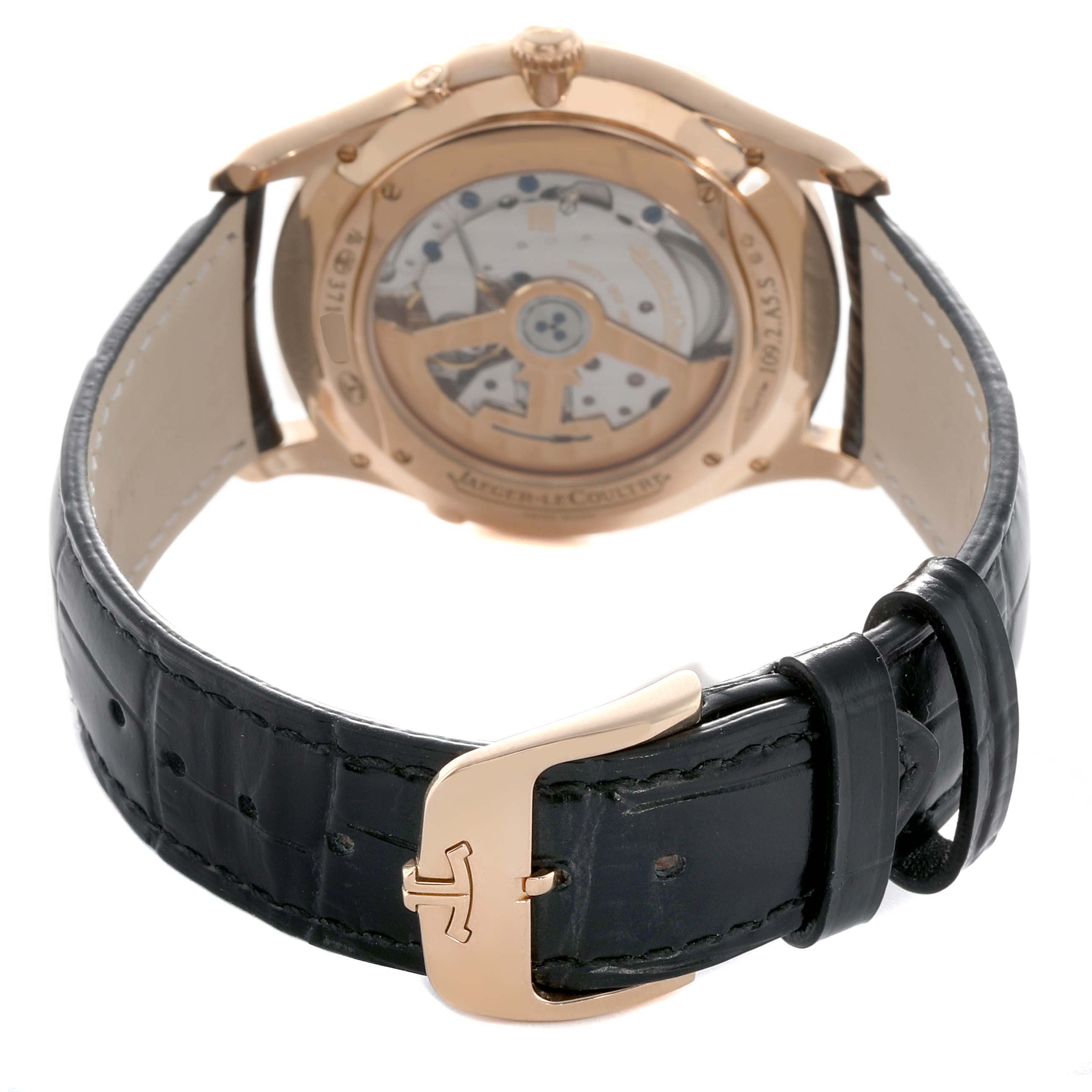 The image shows the back of the Jaeger-LeCoultre Master watch, highlighting its movement and leather strap with a clasp.