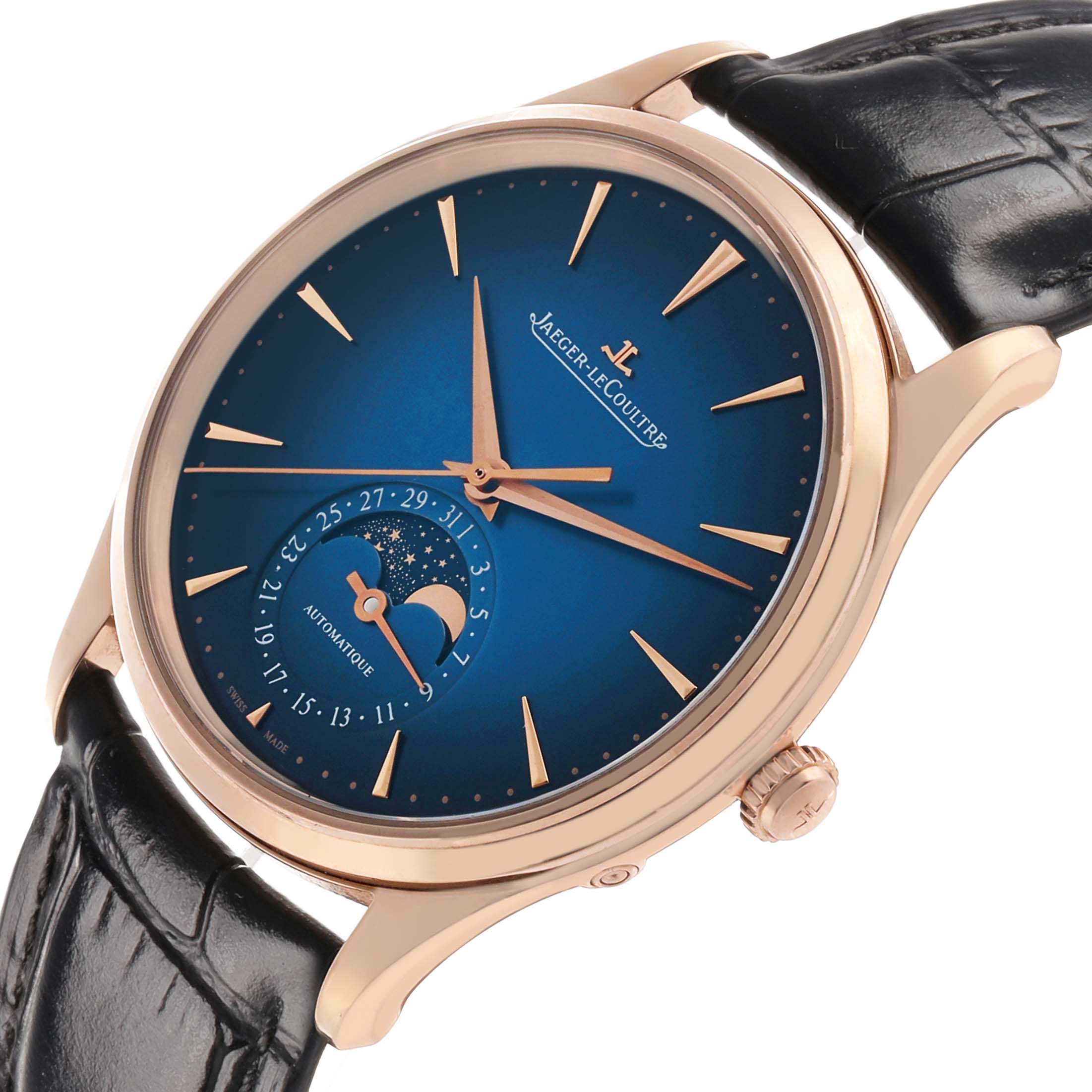The Jaeger-LeCoultre Master watch is shown at a slight side angle, highlighting the blue dial, moon phase, and black leather strap.